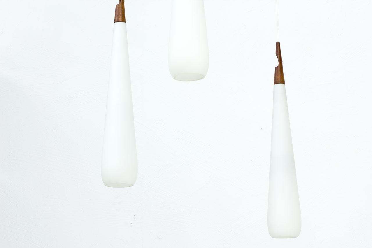 20th Century Scandinavian Modern & Teak Opaline Glass Pendant Lamps by Luxus, Sweden