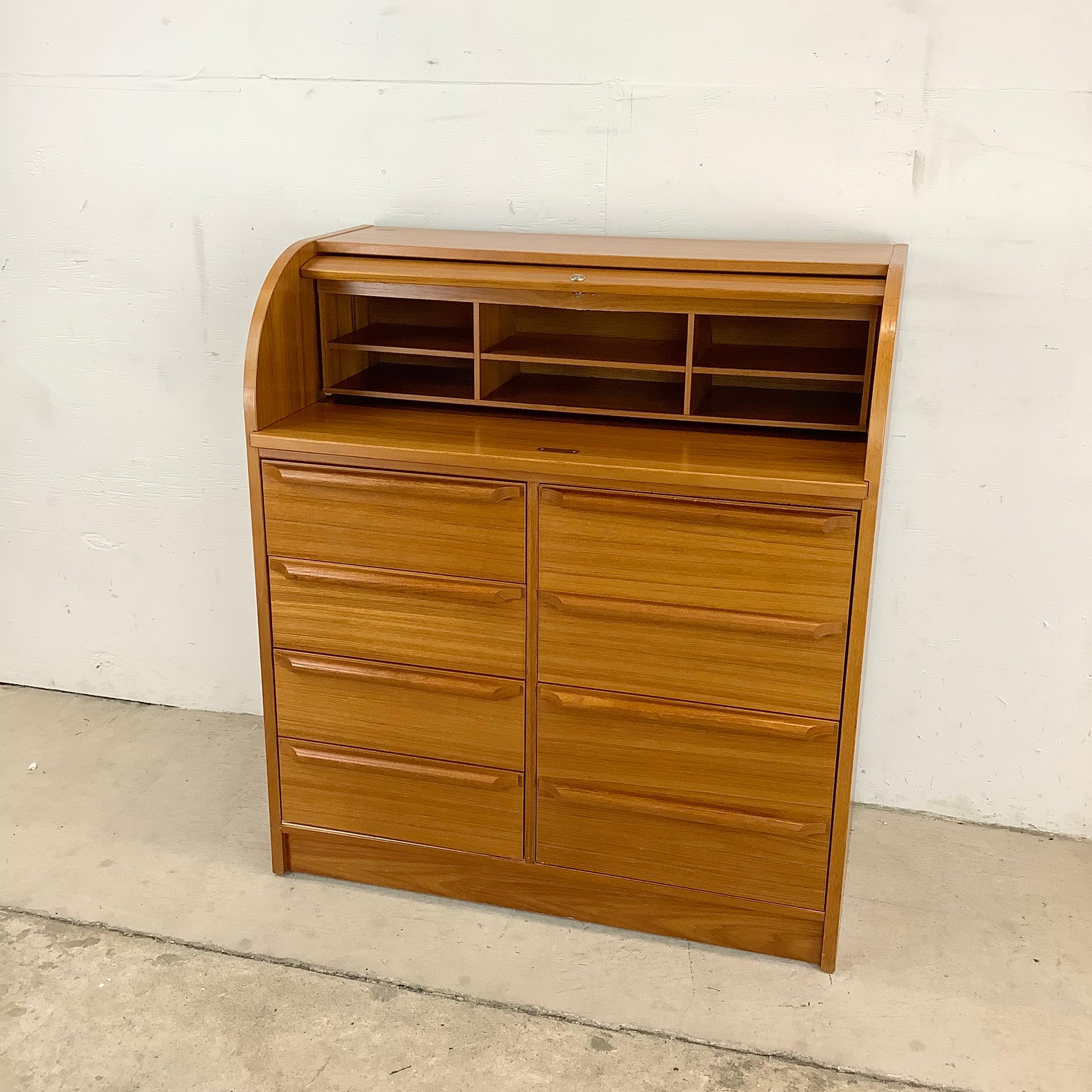 Introducing this Vintage Modern Teak Rolltop Desk, a sleek and sophisticated piece of furniture that seamlessly blends timeless Danish design with practical functionality. Crafted from rich teak wood, known for its durability and natural beauty,