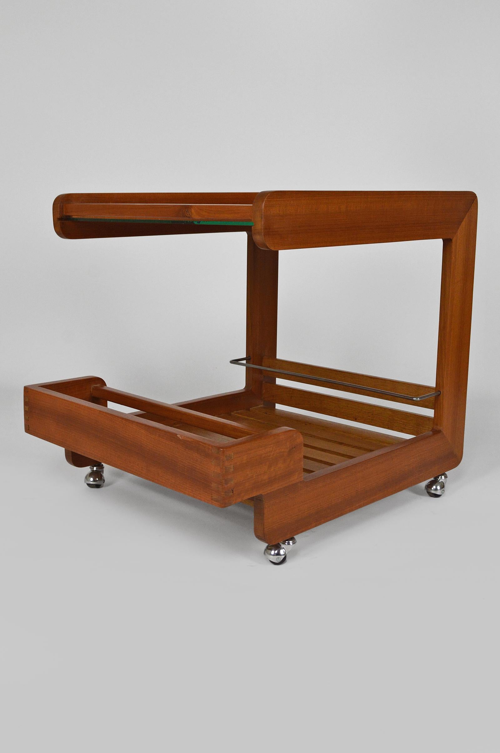 Rare serving table / bar cart / trolley.
In teak, with mirror top.
Steel bar to hold bottles.
The wheels are chromed.
Scandinavia, circa 1970.
In very good condition.