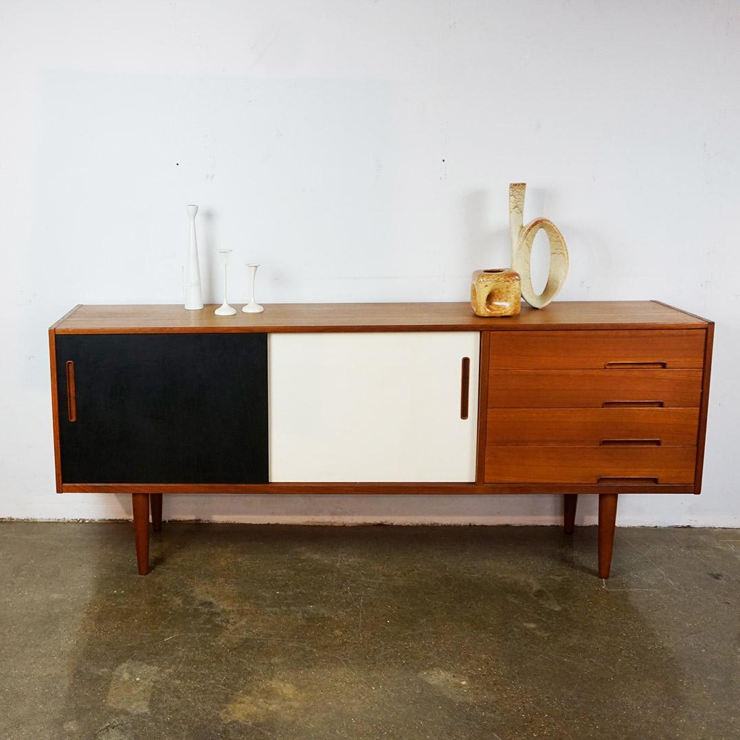This excellent scandinavian modern sliding door credenza or sideboard has been designed by Nils Jonsson for Troeds, Sweden 1960s, Model Trento.
Its exquisite craftsmanship reresents a distinctive Scandinavian Modern style, Crafted with precision and