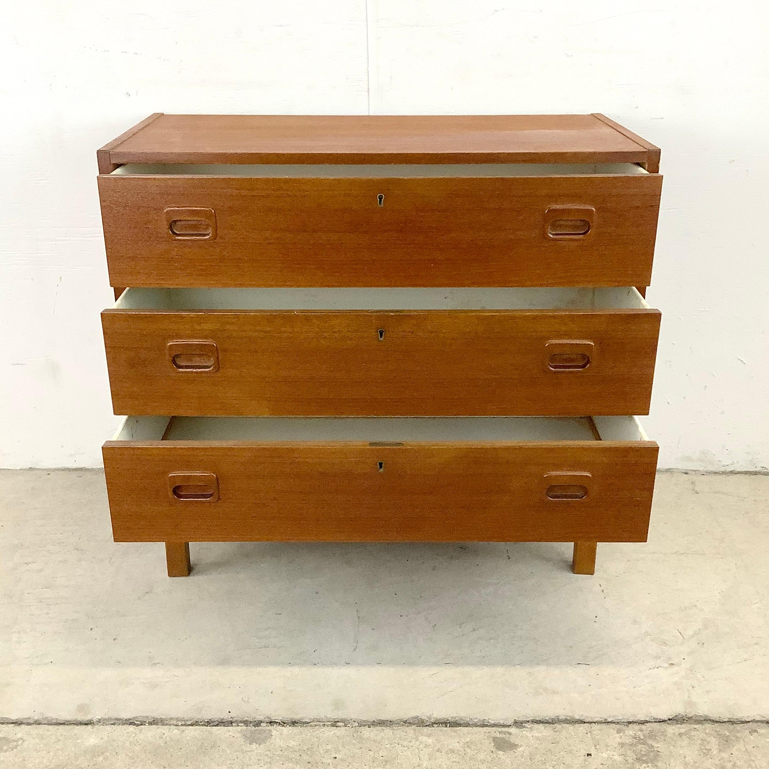 This stylish petite teak three drawer dresser features vintage Scandinavian modern design and makes a striking addition to any interior in need of extra storage or a unique console table option. Perfect vintage teak dresser for space challenged