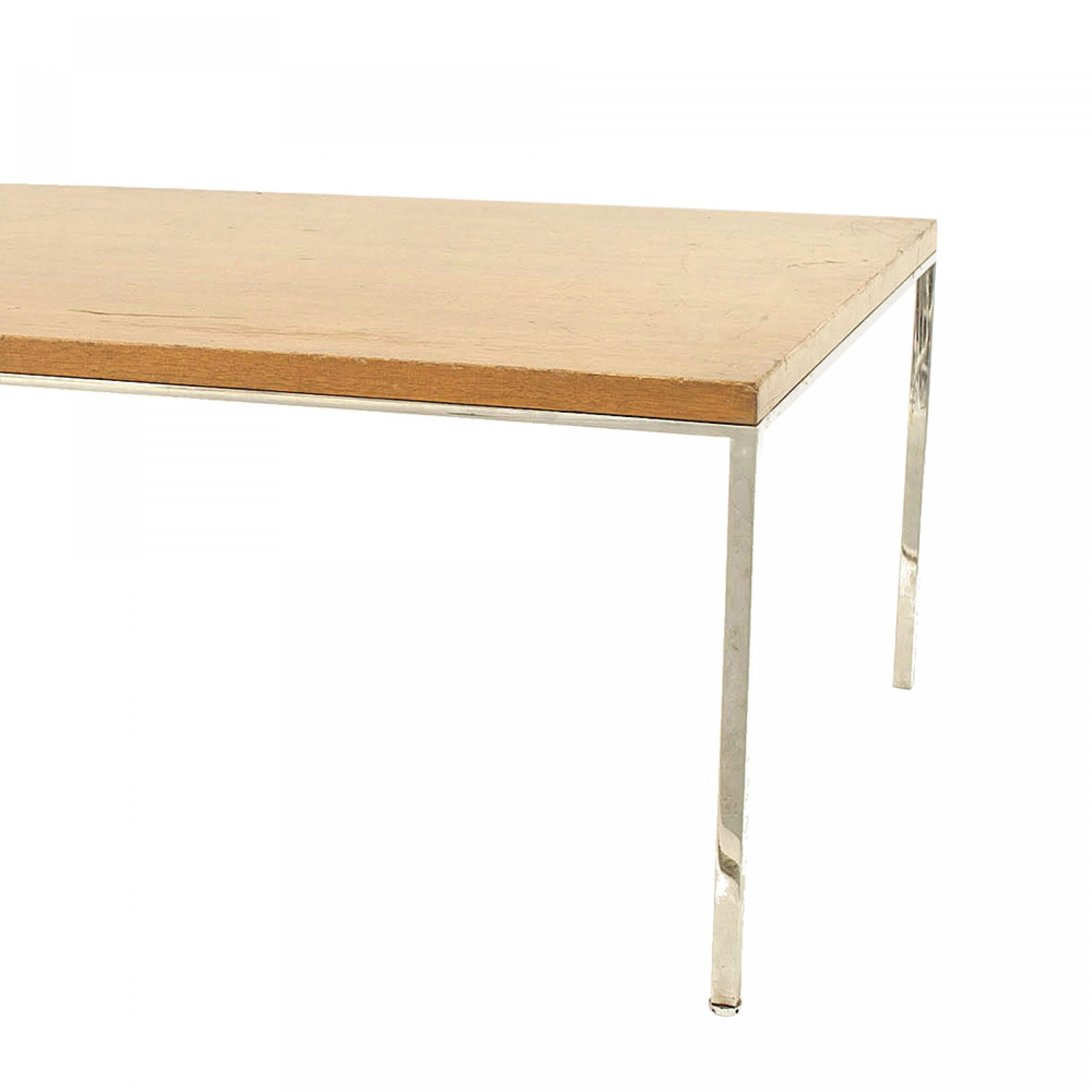 Scandinavian Modern rectangular coffee table with a teak veneer top and a chrome base and legs.

Vintage condition.
