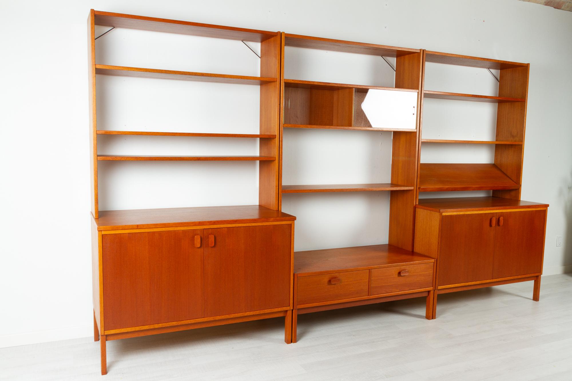 Scandinavian modern teak wall unit by Ulferts 1960s
Large Scandinavian modern modular teak wall unit with cabinets and shelves. This unit consists of three lower modules and three top modules that can be combined as desired. 

Two cabinets with