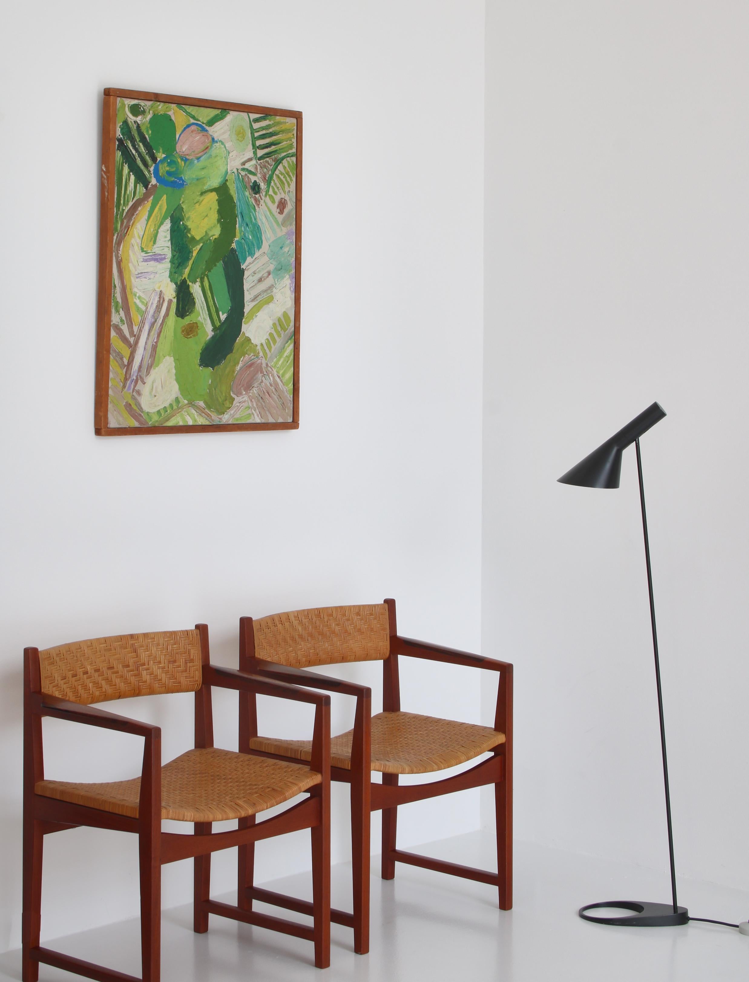 Amazing set of vintage armchairs made in the late 1950s at Søborg Møbelfabrik, Copenhagen by Peter Hvidt & Orla Molgaard Nielsen. The chairs are made from solid Bangkok Teakwood and features Rosewood inlays in the arms. The chairs both retain the