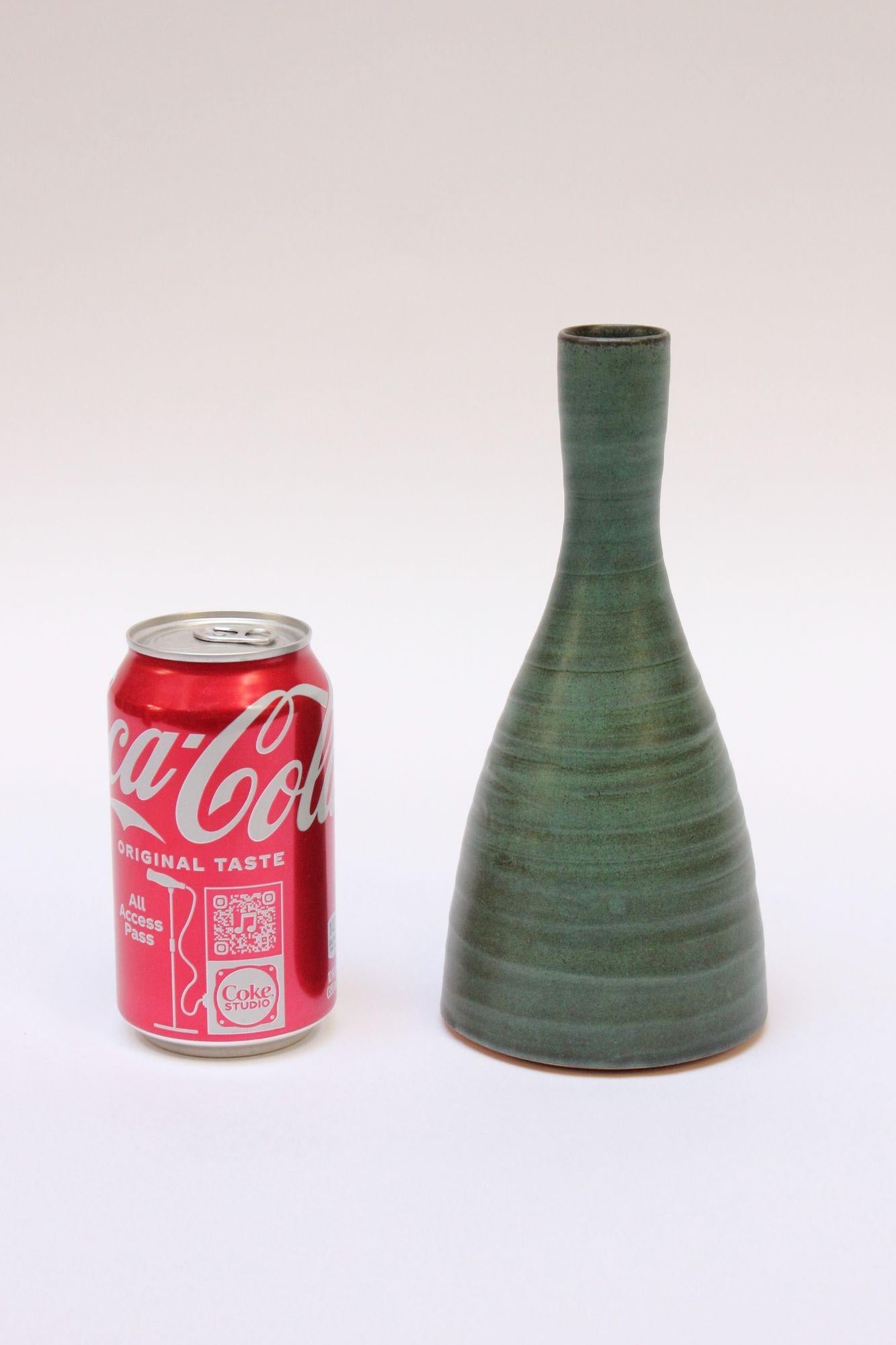 Mid-Century Modern terracotta vase with green glaze and banded/swirl pattern. 
Excellent, vintage condition free of flaws.
Artist cipher engraved to the reverse.
Measures: Height: 8.25