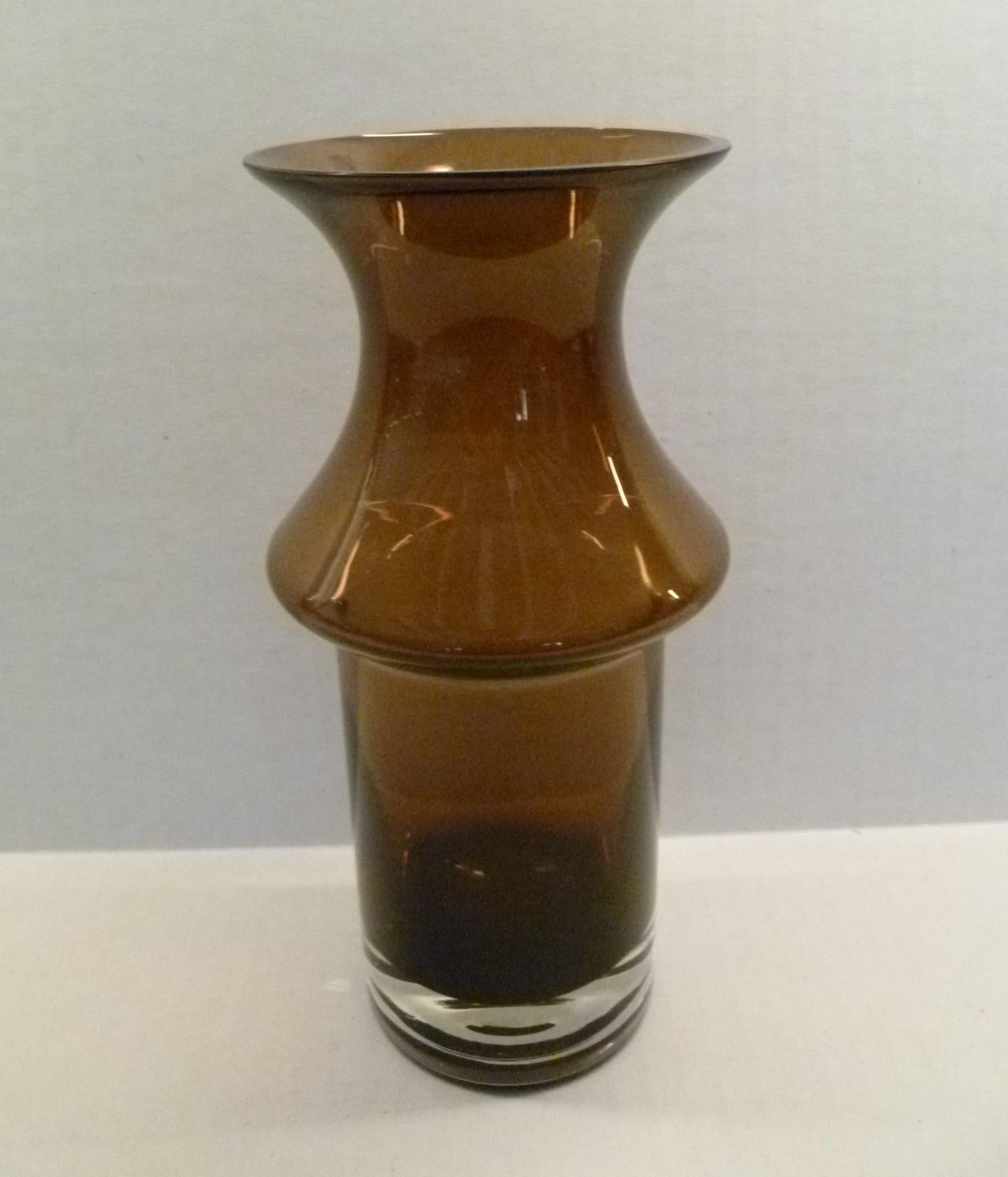 The Tulppaani (Tulip) Collection of vases by Tamara Aladin ( b.1932) for Riihimaki consisted of slightly different shapes and colors and were produced from 1971 until the end of art glass production by the company in 1976. This vase in warm brown