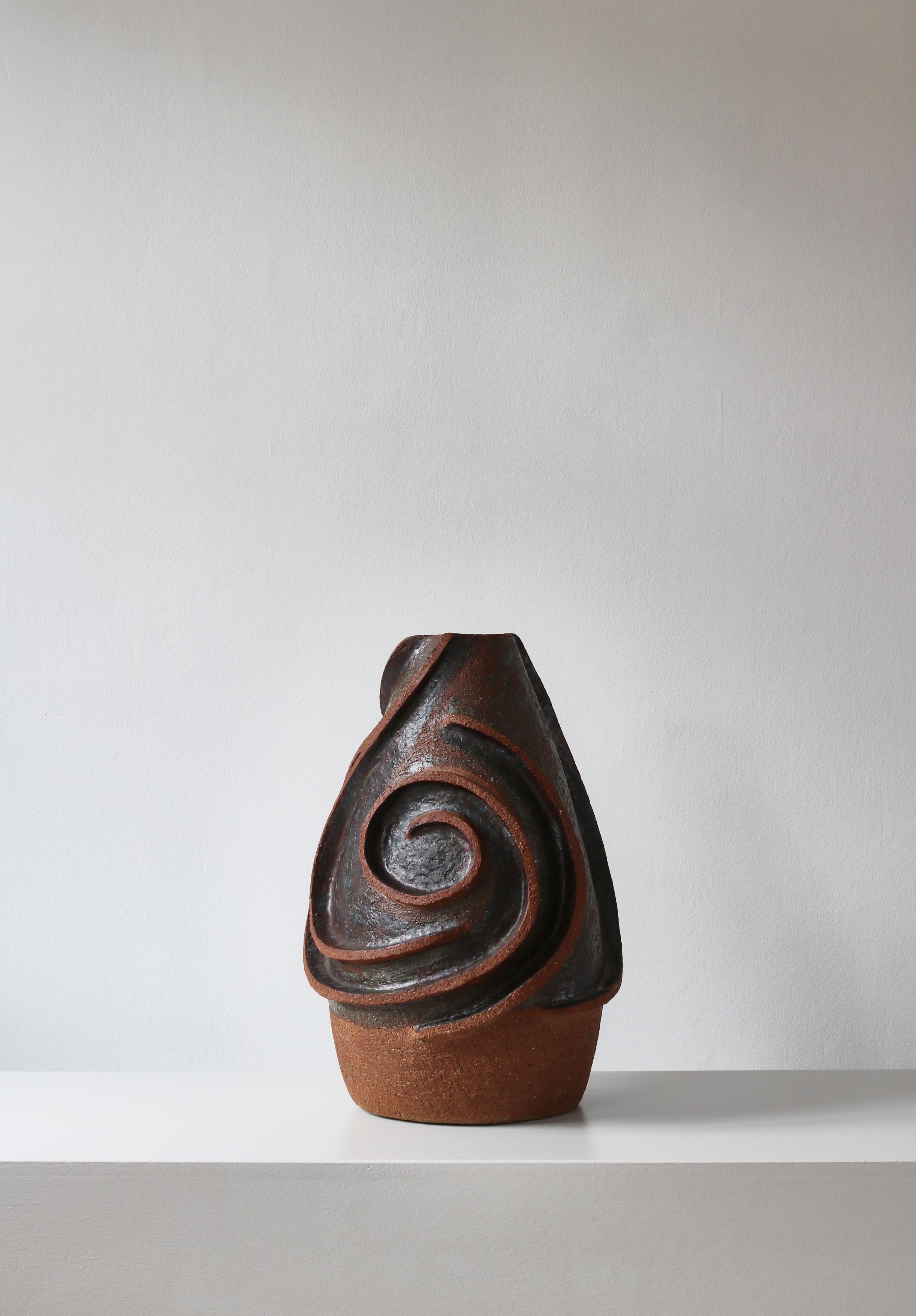 Amazing large handmade ceramic sculptural vase made in Denmark in the 1960s. Made in chamotte clay and partly glazed in earth colored glazing.