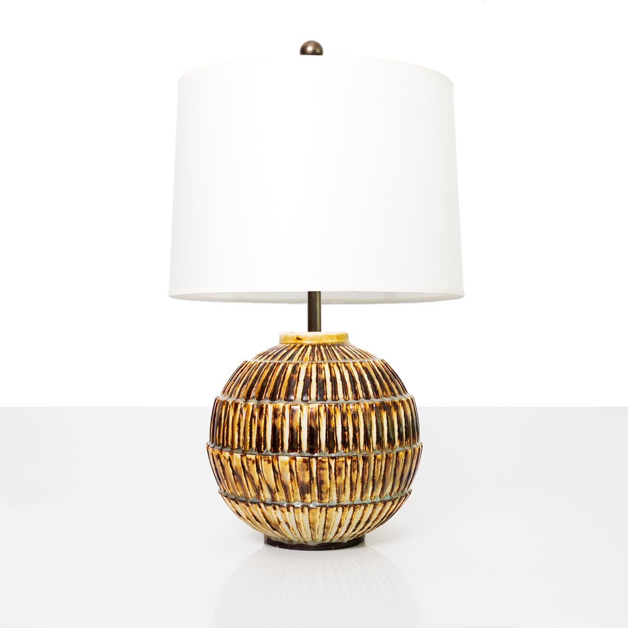 Large and rare Swedish art deco unique ceramic studio lamp by Gertrud Lonegren. Her pieces are known for strongly textured surfaces combined with subtle use of glazes. Lamp has been rewired with a polished and lacquered brass double cluster and two