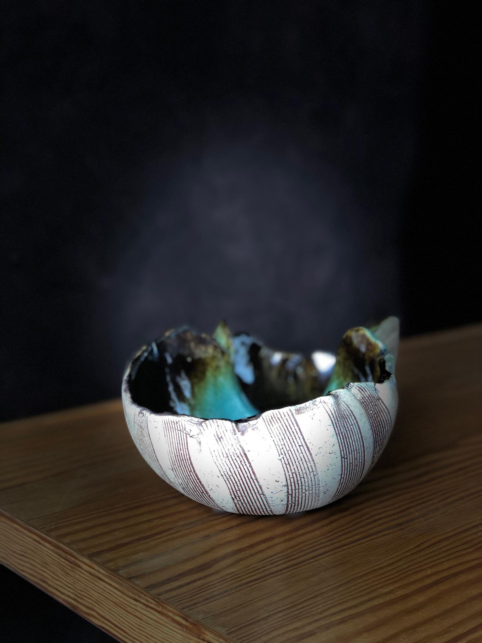 Scandinavian Modern very unusual hand built double bowl by artist Bengt Berglund. The asymmetric form are typical for Bengt Berglunds design produced at Gustafsbergs Studio between 1960-1977. The exterior of the bowl is partially glazed. The