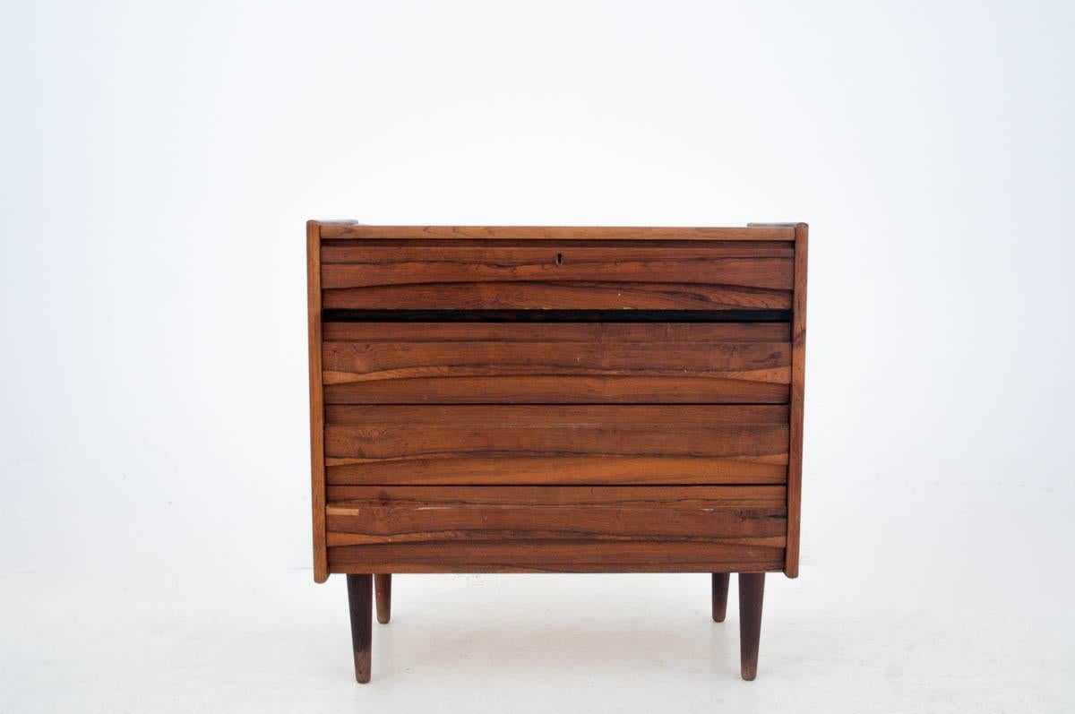 Dressing table - a chest of drawers produced in Denmark in the 1960s.

Made of high quality wood - rosewood.

The upper part opens - with a mirror, small cabinets and a retractable top.

At the bottom there are 3 spacious drawers.

Currently