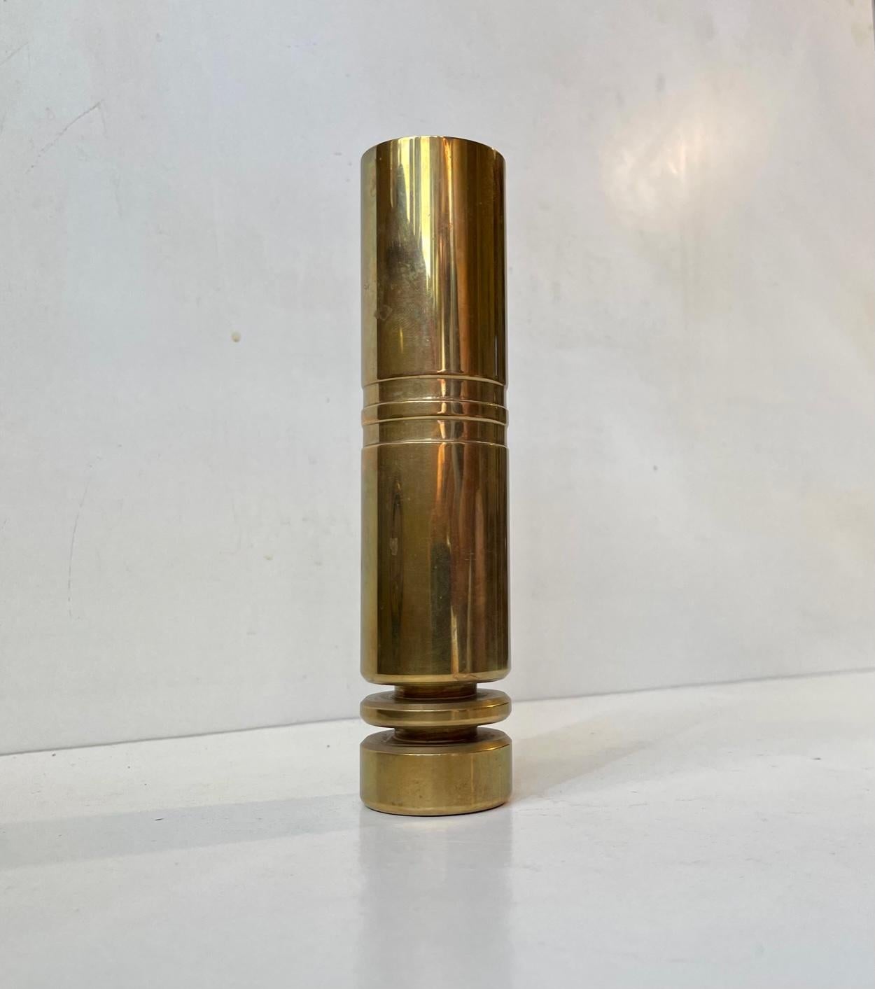 Heavy cylindrical Scandinavian vase in solid bronze. Horizontal ribbings/tiers towards its base and two center stripes - incised/engine-turned. Unknown Scandinavian maker/designer in the style of Pierre Forsell. Measurements: H: 19 cm, Diameter: 4.5