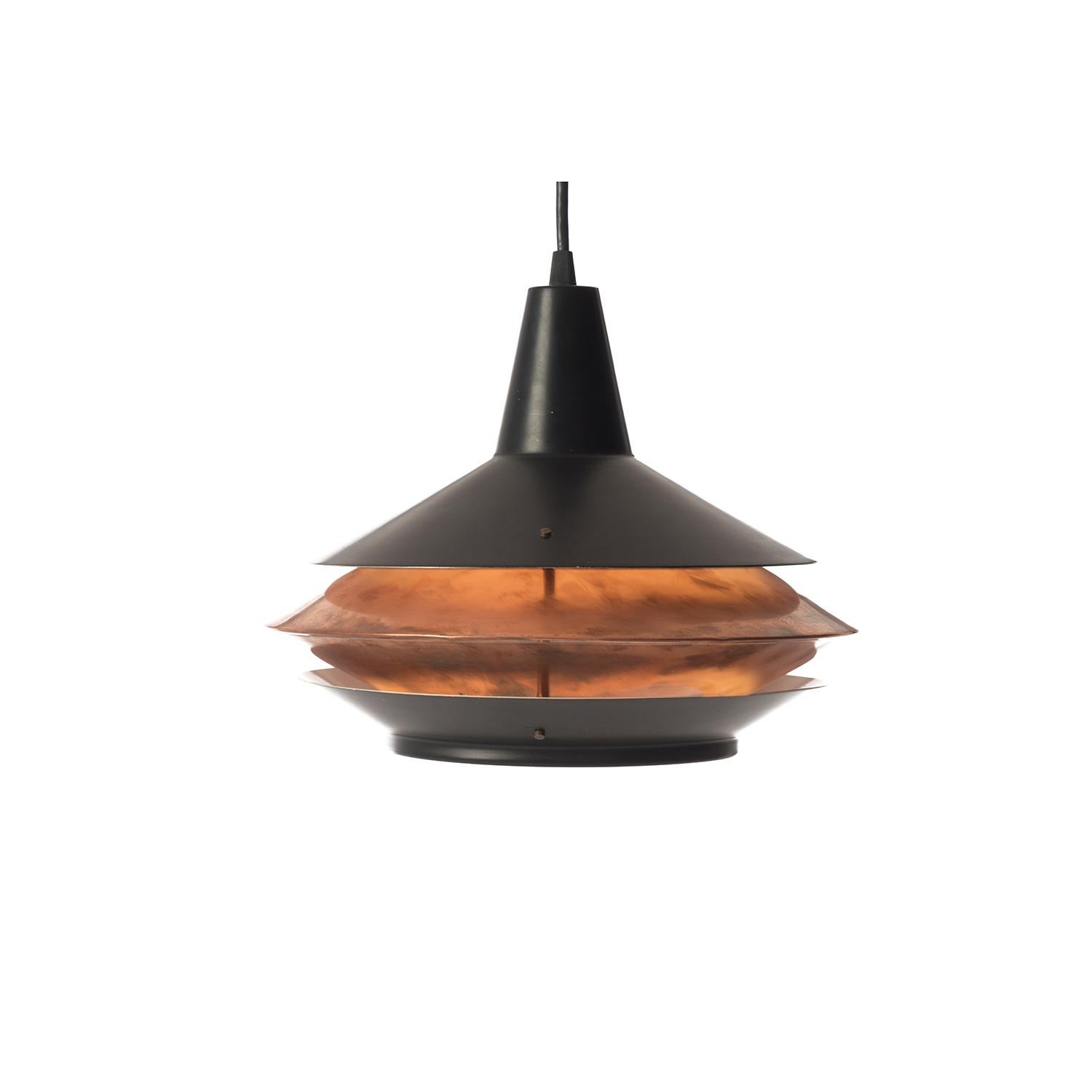 This vintage original pendant fixture is shaped like a lantern, the patinated copper plated interior emits a warm glow from within. The fixture has been updated with North American socket and wiring. It can be plugged in or hard-wired. 100 watt