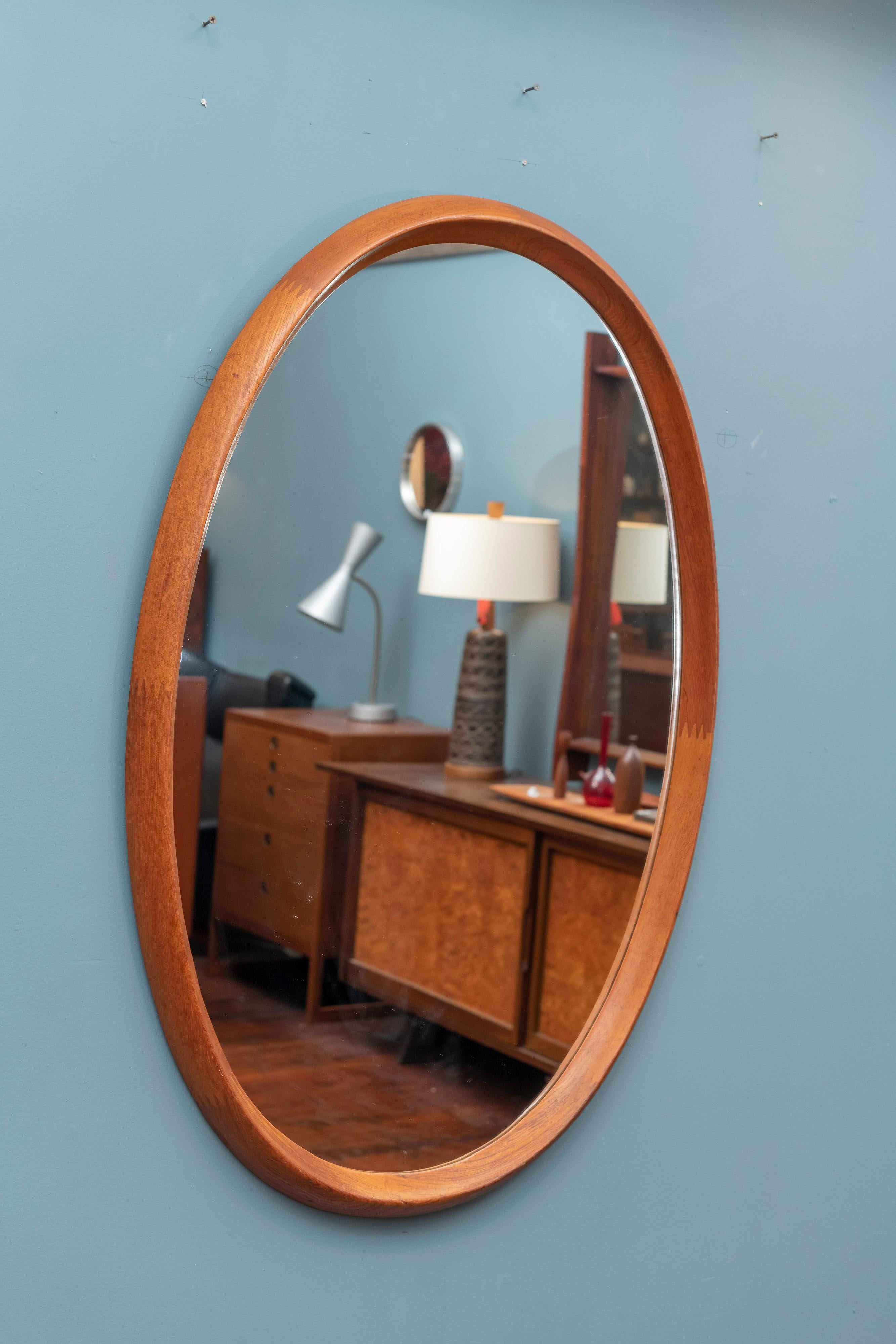 Scandinavian modern teak oval wall mirror by Pedersen & Hansen, Denmark. Large mirror 44