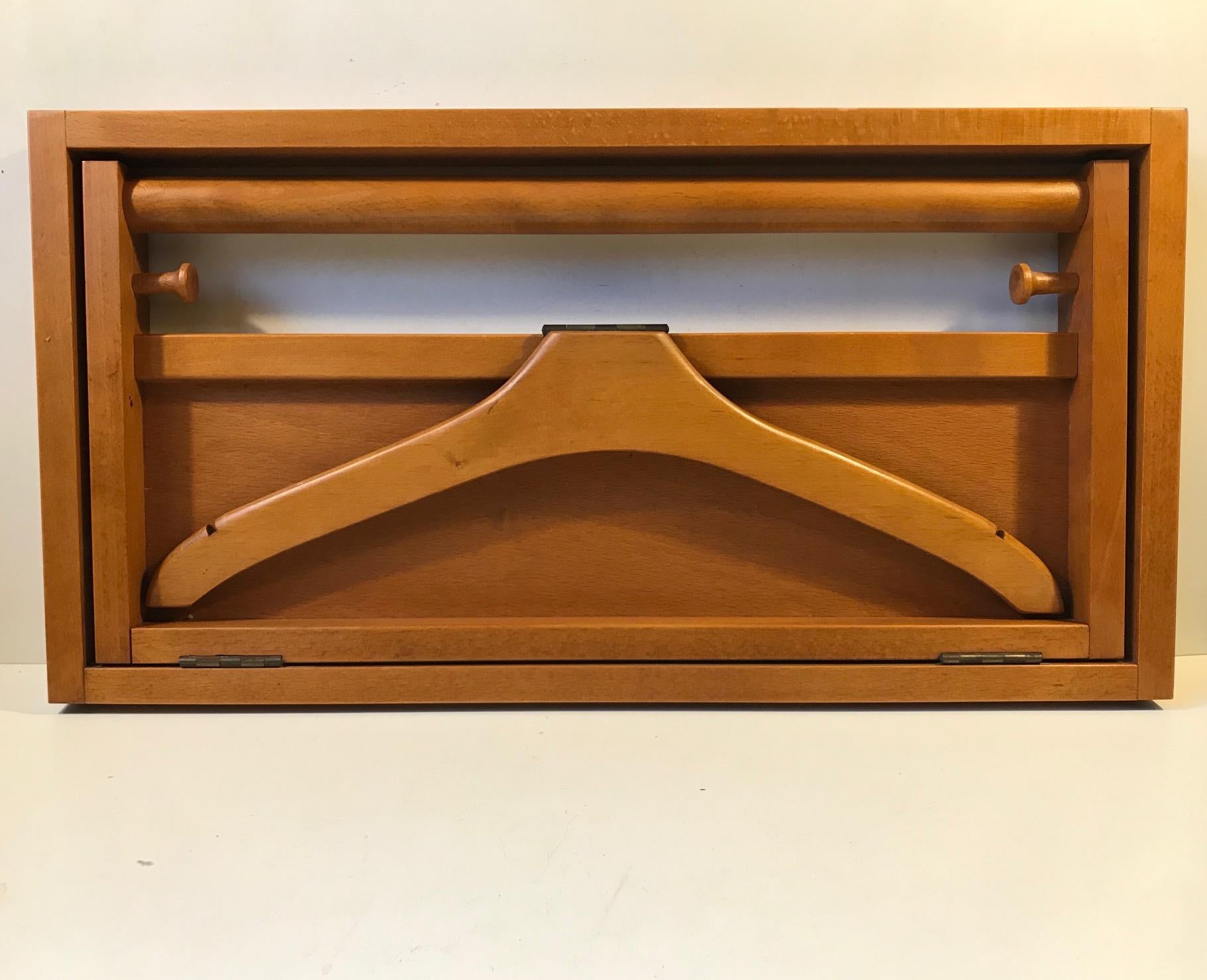 Foldable wall valet in solid cherrywood. Designed and manufactured in Scandinavia in a style reminiscent of Adam Hoff & Poul Østergaard.