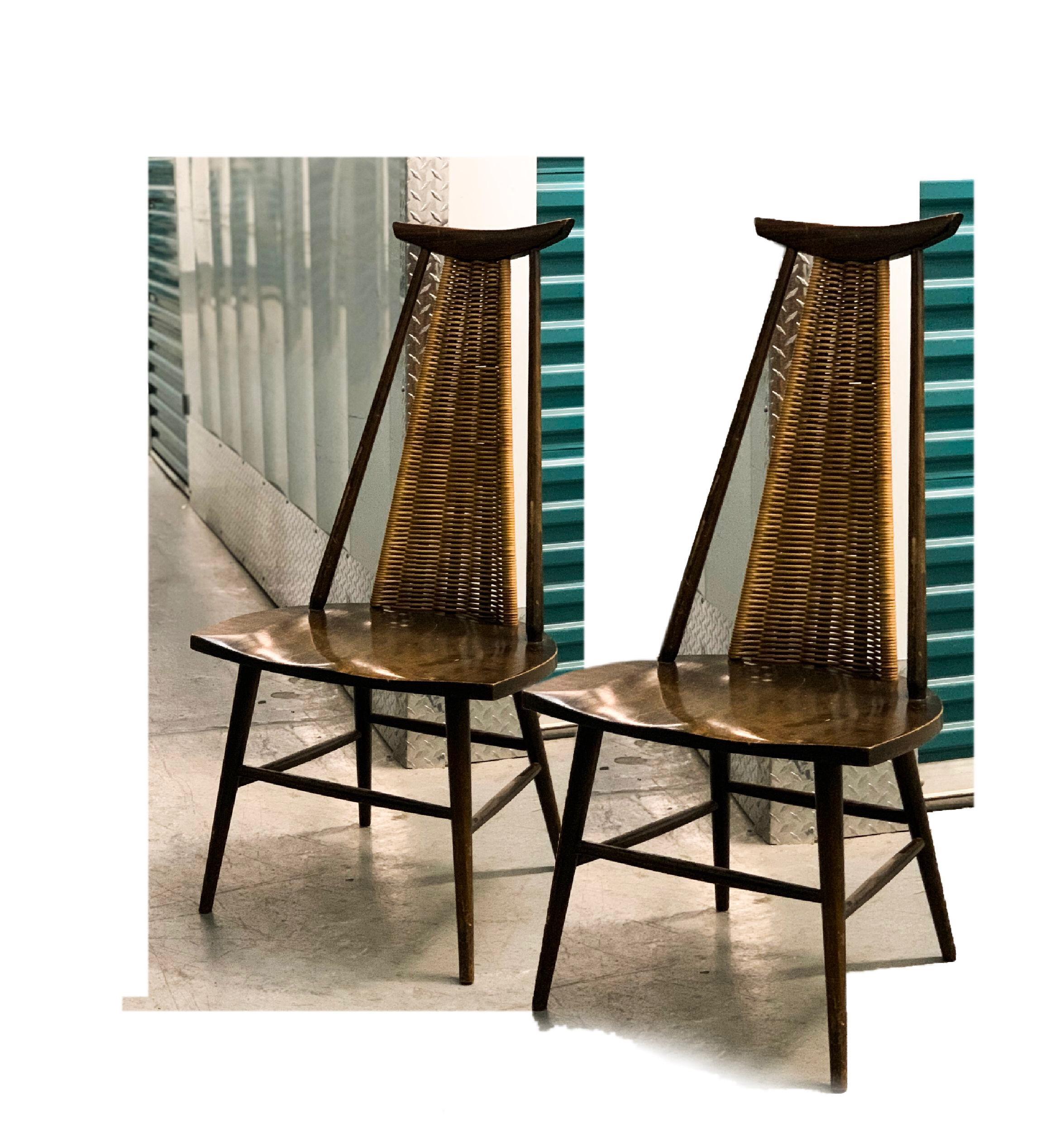 Striking 1950s wicker-back easy chairs by Finnish designer Ilmari Tapiovaara. 

Extremely rare and exquisite pair of easy chairs by Finnish Architect Ilmari Tapiovaara. The chairs are Fine example of Tapiovaara known to combine modern design