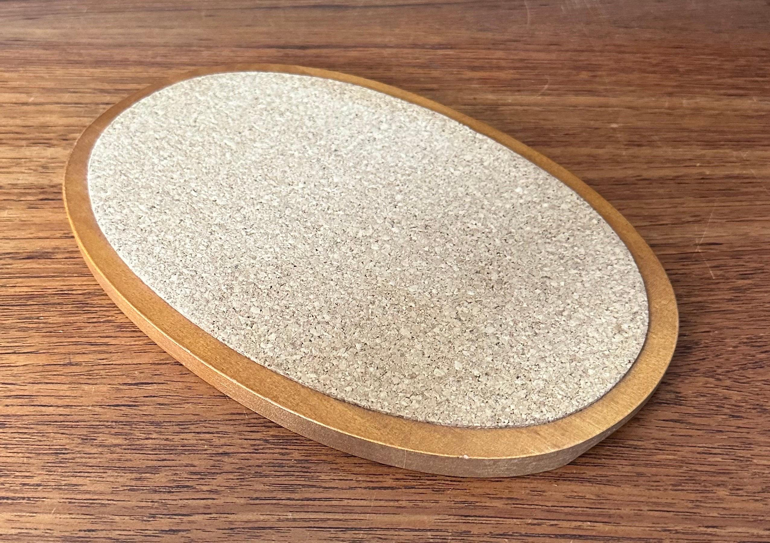 A very nice Scandinavian modern trivet with inlaid cork, circa 1970s. The trivets are in very good vintage condition and measures 10.25