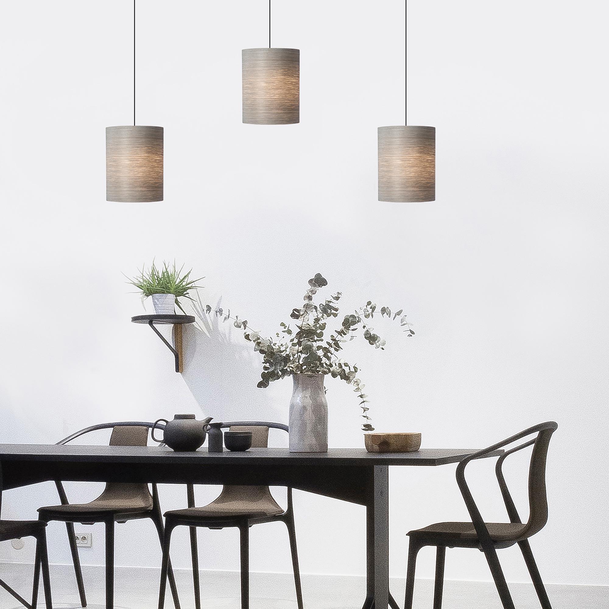 Centa is a contemporary, Mid-Century Modern light fixture. This is a minimalist luxury pendant design and can be exhibited in dining rooms, entryways, alcoves, and over kitchen islands. Gray Tay is harvested from the African Koto tree. The