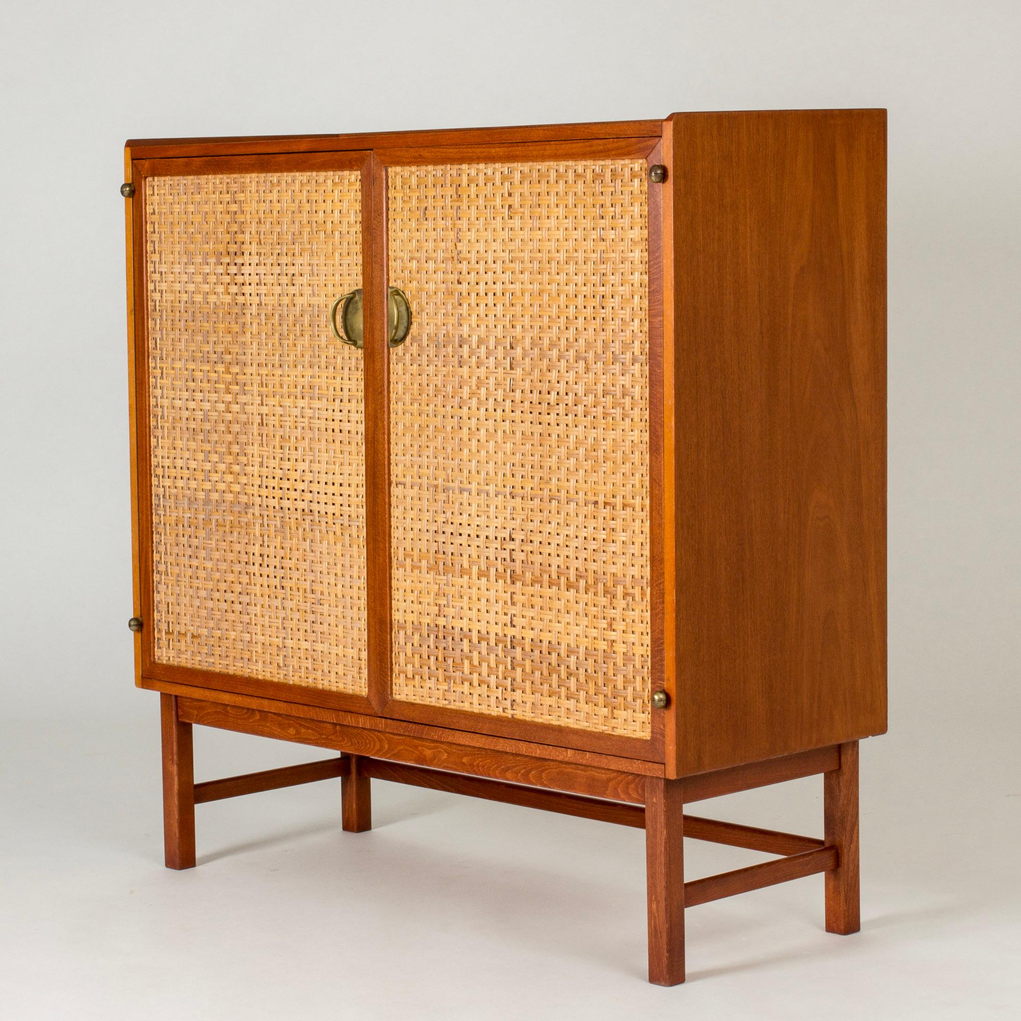 Beautiful mahogany cabinet from Westbergs Möbler, with rattan fronts and beautiful brass handles and hinges. Great attention to detail, also to the inside which is made with lighter wood, with cooly designed drawers.