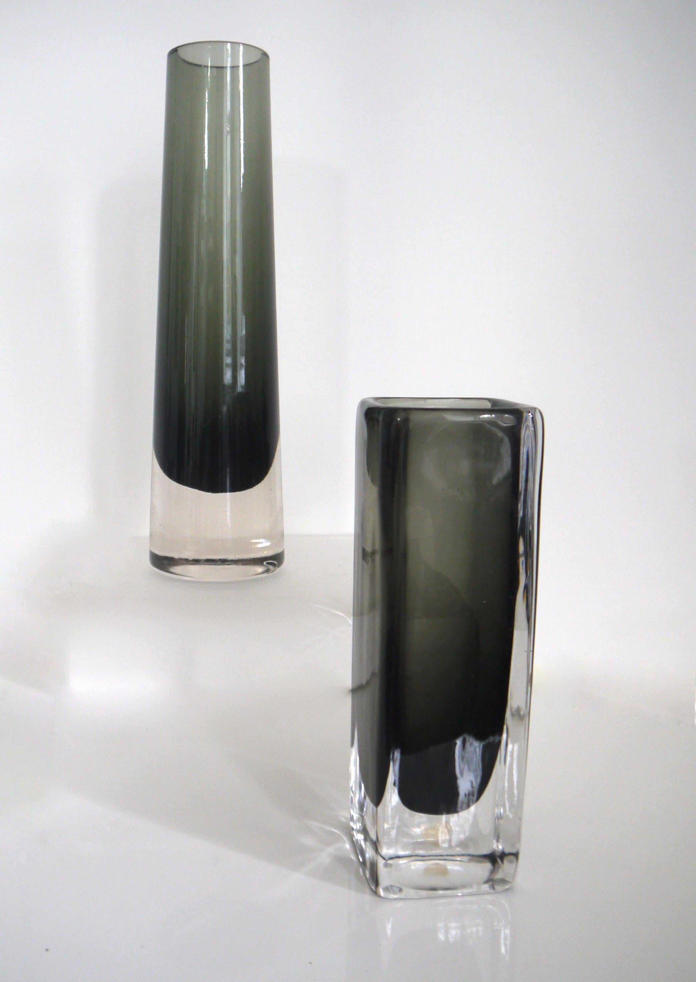 Scandinavian Modernist vases Elme Glasbruk and Nils Landberg for Orrefors, 1958
Two-piece set. 

The 'bubble glass' is a black smoke from Elme Glasbruk 
Height 24 cms, diameter at base 7 cms and at mouth 4 cms

The slab vase is by Nils