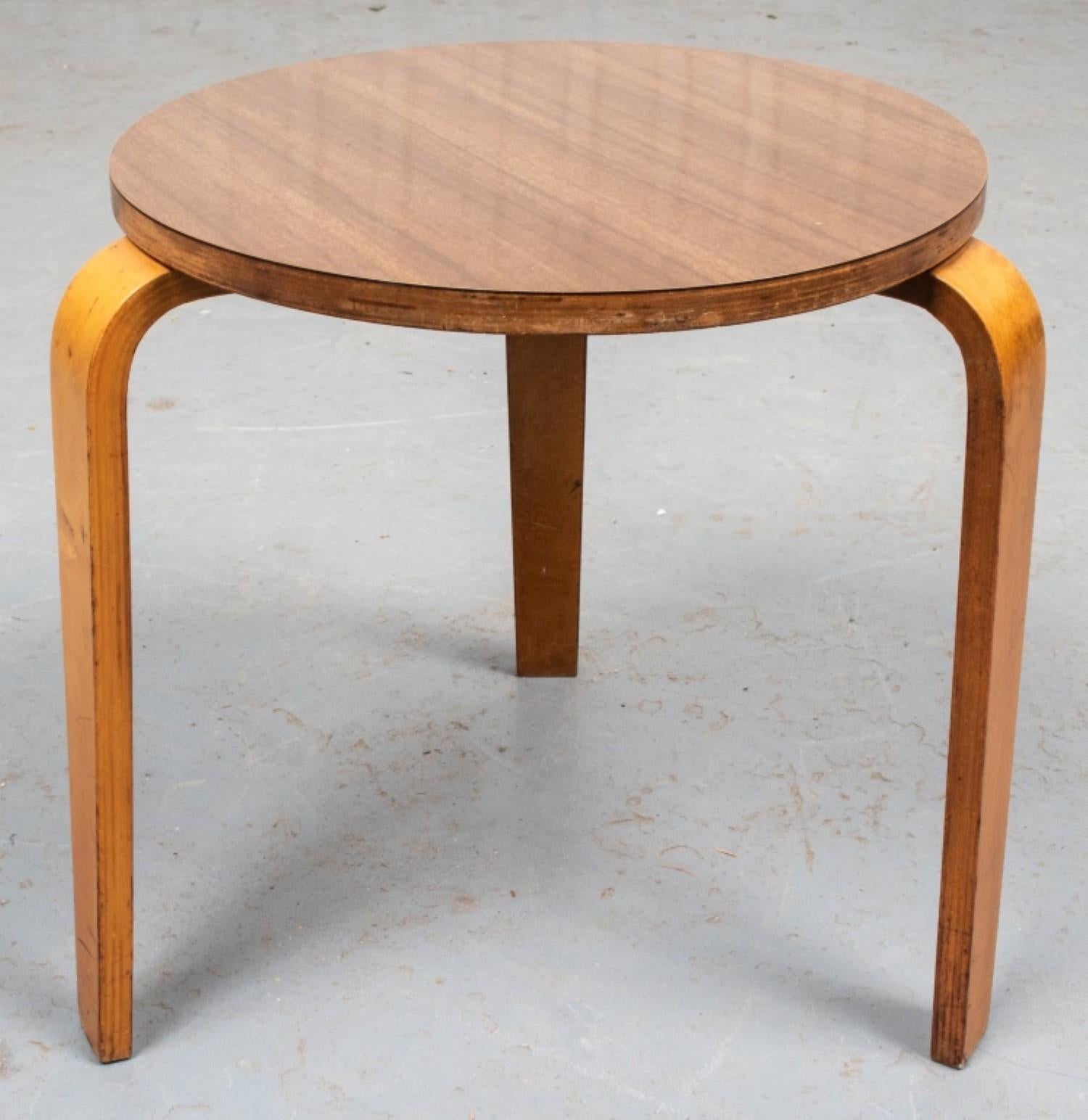 Scandinavian Modern Side/Occasional Table

Style: Scandinavian Modern
Design: Inspired by the Model 60 stacking stool by Alvar Aalto (Finnish 1898-1976)
Features: Round laminate top over three L-form teak legs.

Dimensions: 15.5