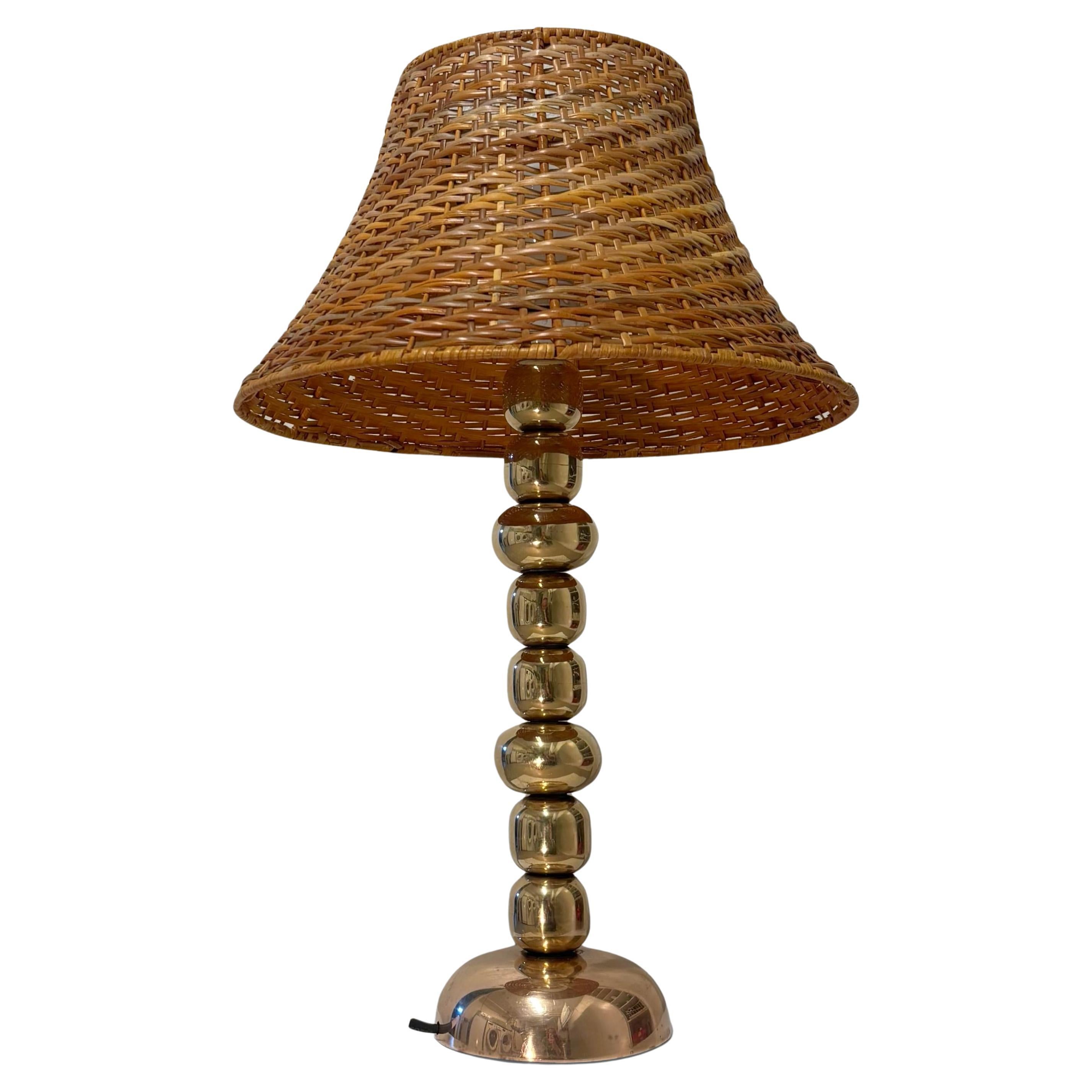 Scandinavian modernist table lamp, brass spheres and rattan, Sweden, 1960s