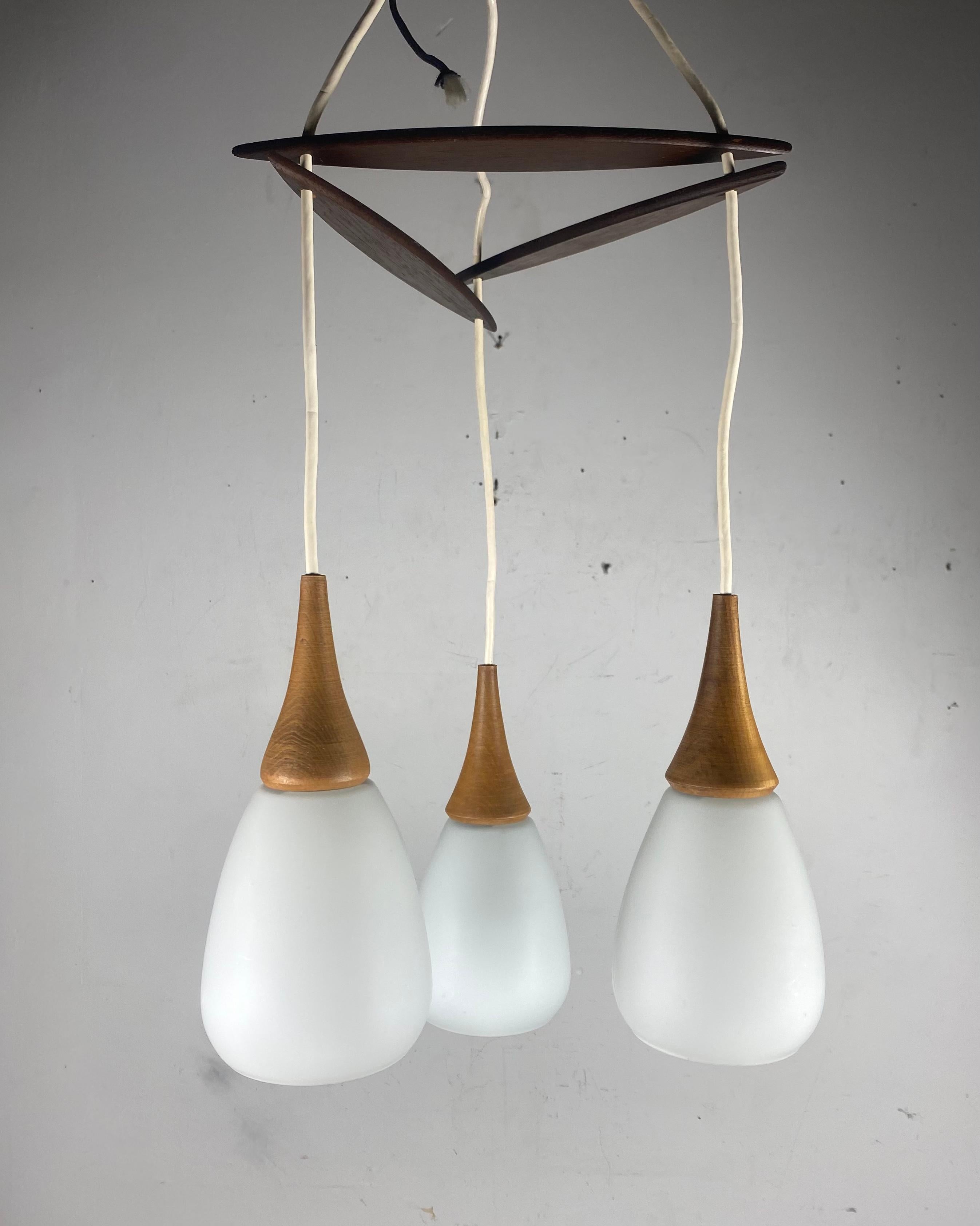 Scandinavian Modernist Triple Pendant Lighting.. Teak and Glass.. Holmgaard 2