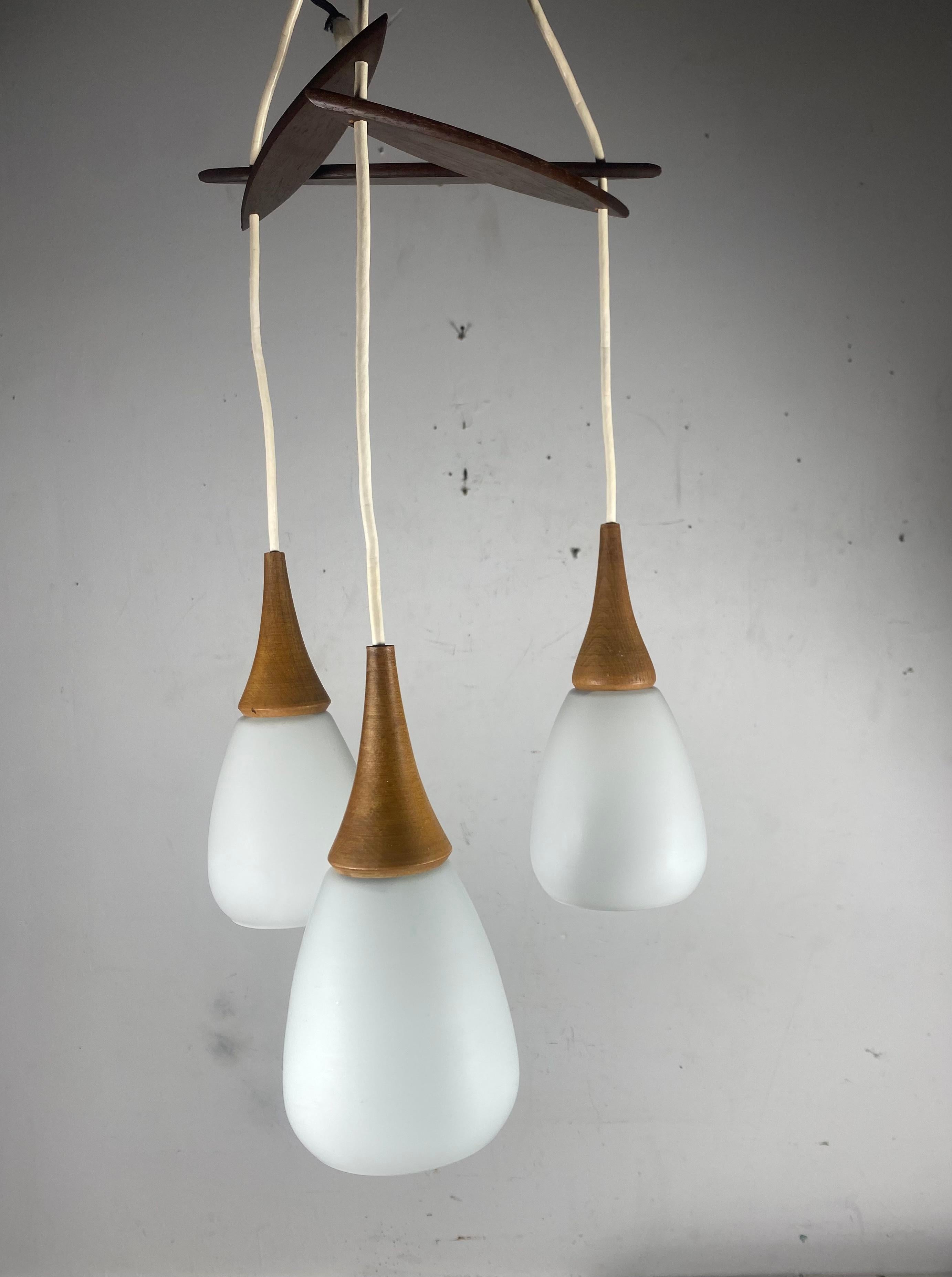 Danish Scandinavian Modernist Triple Pendant Lighting.. Teak and Glass.. Holmgaard