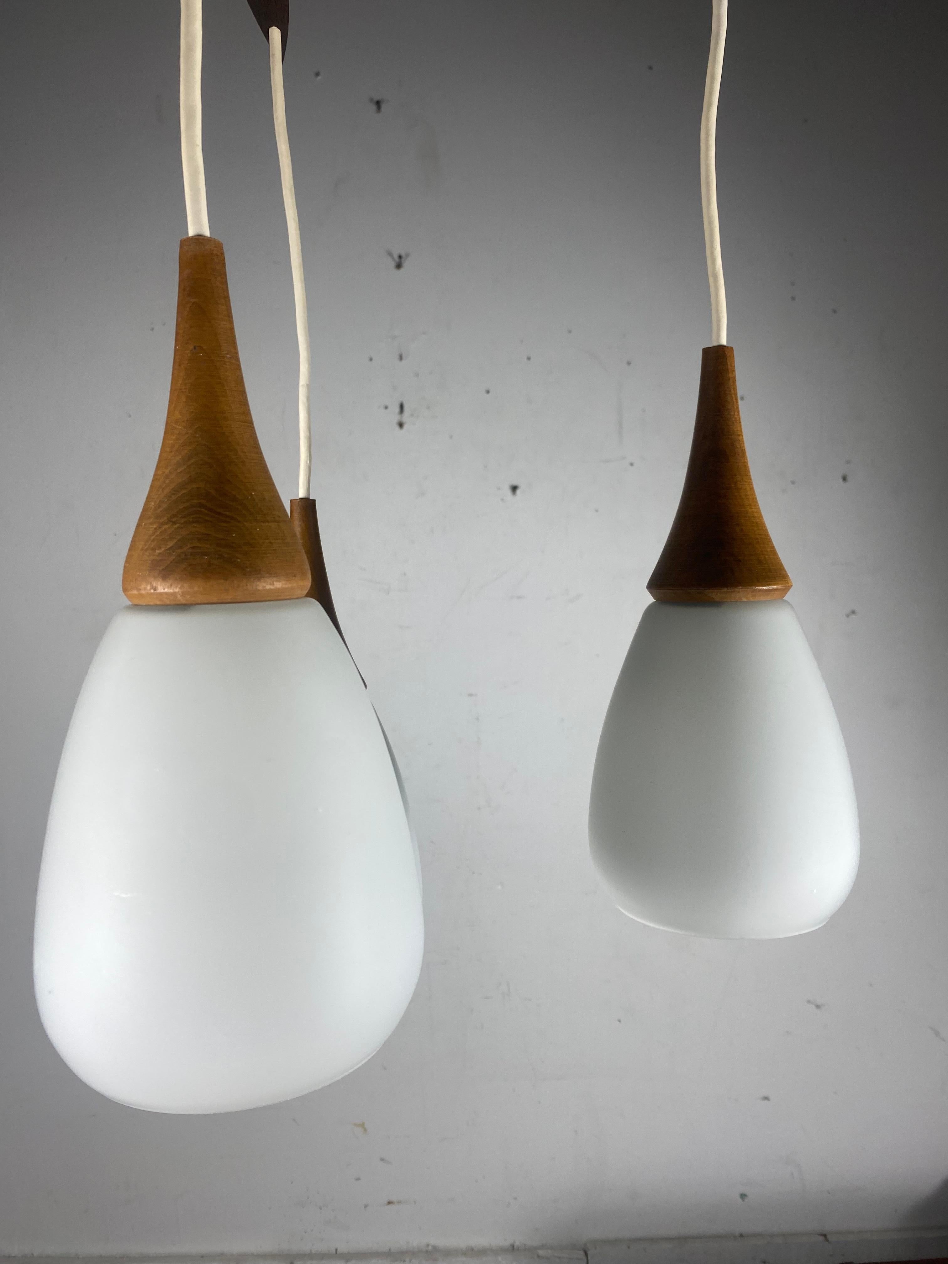 Blown Glass Scandinavian Modernist Triple Pendant Lighting.. Teak and Glass.. Holmgaard