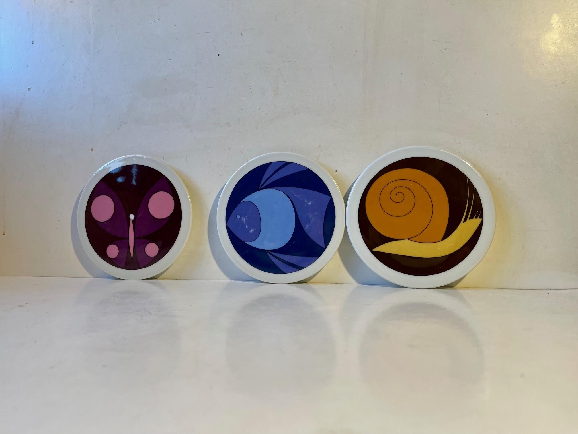 A snail, a butterfly and a fish. Modernist interpretations by the Danish artist Ib Antoni (1929-73). Transfer-printet onto fiaence/ceramic. Manufactured by B&G in Denmark during the early 1970s. Use them as trivets and display them on your wall.