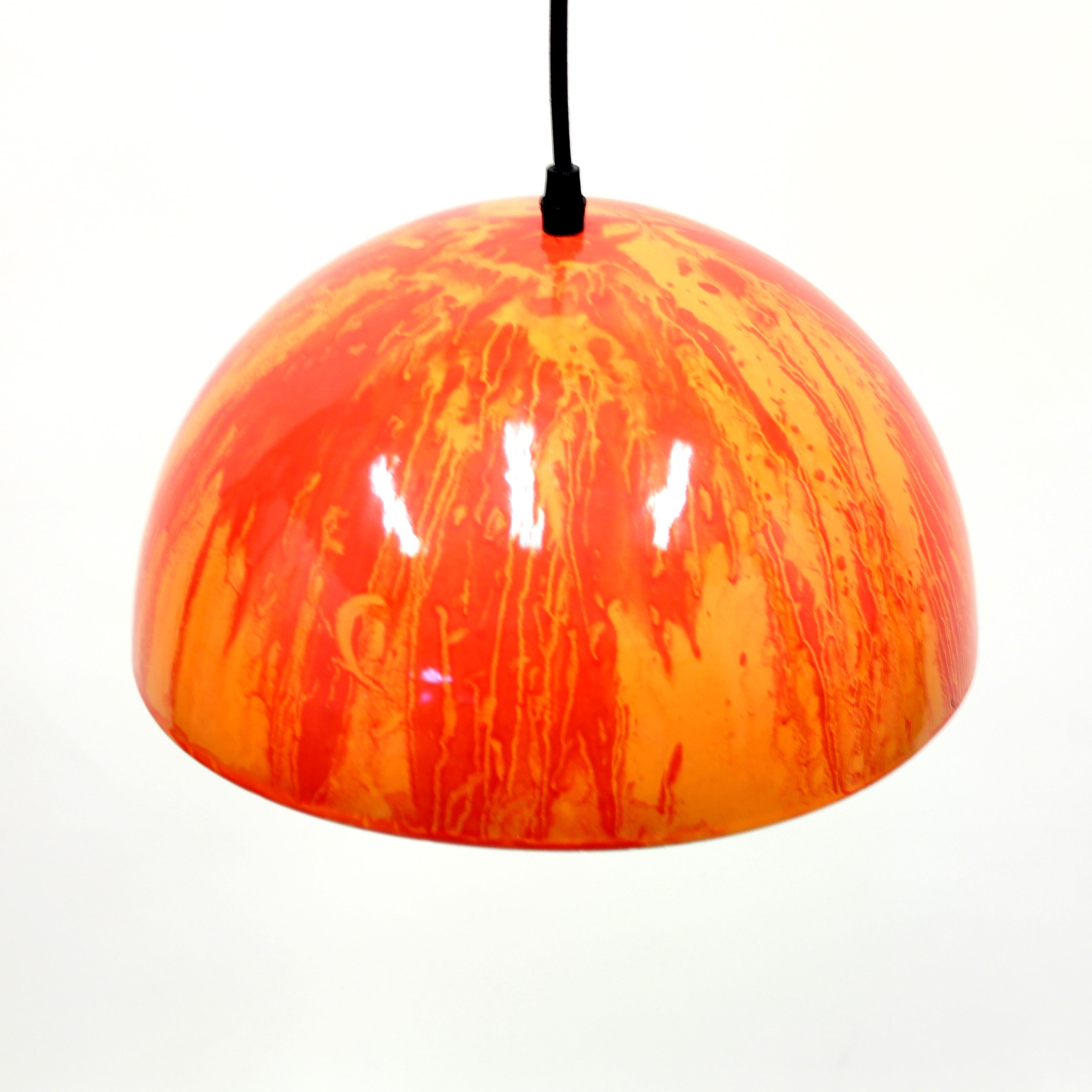 Red and orange enamel ceiling lamp from the 1970s. Most likely Swedish or Danish. White on the inside. Unknown producer. Good vintage condition with minor ware and completely new electric components including cable and plug.