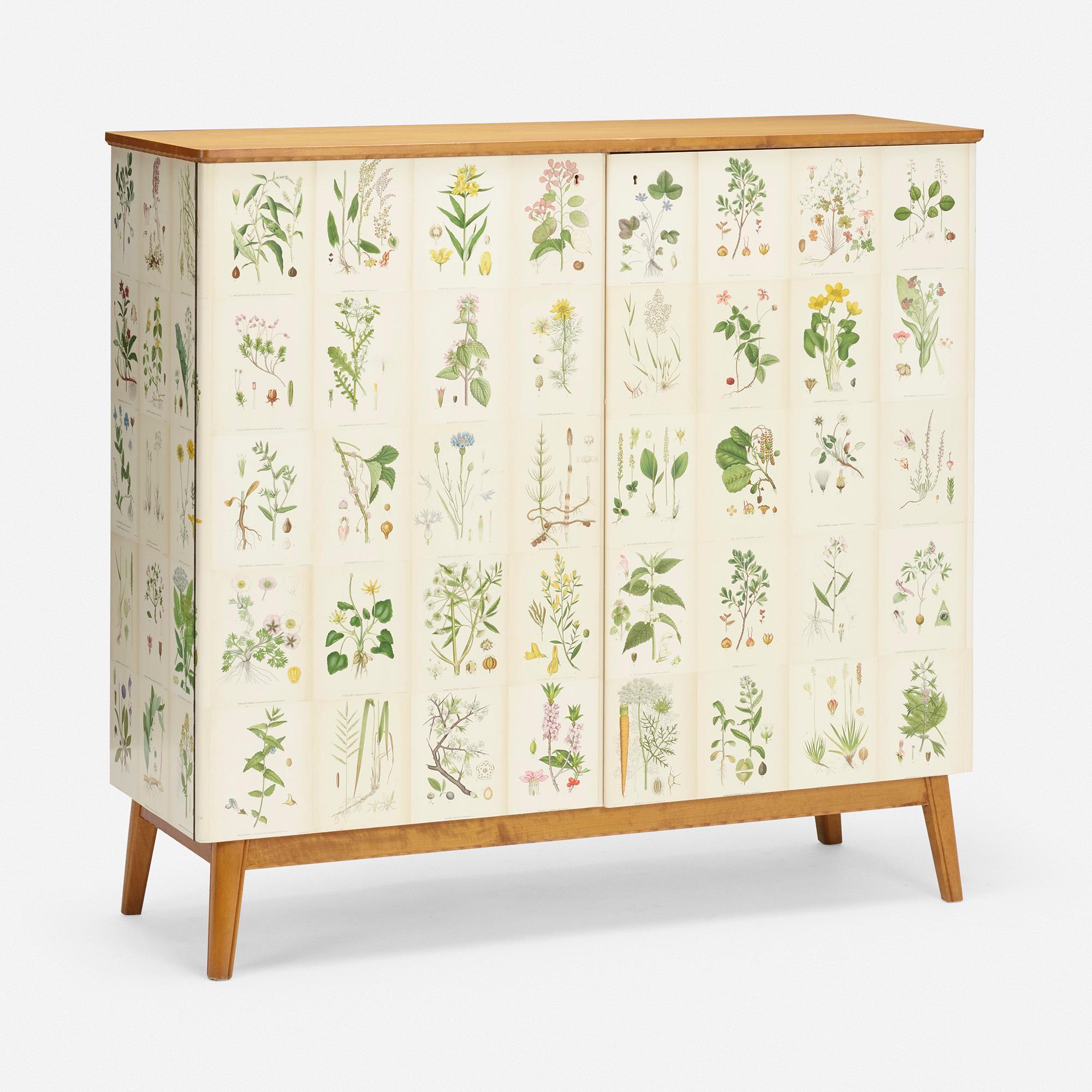 Scandinavian Nordens flora cabinet, circa 1945.

Cabinet features two locking doors concealing two drawers, four removable shelves, and storage. Cabinet retains key.

Additional information:
Material: birch, applied offset lithograph
Size: 49
