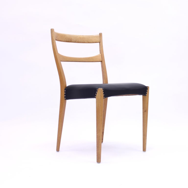 Scandinavian Oak Dining Chairs with Black Leather Seats, 1950s For Sale