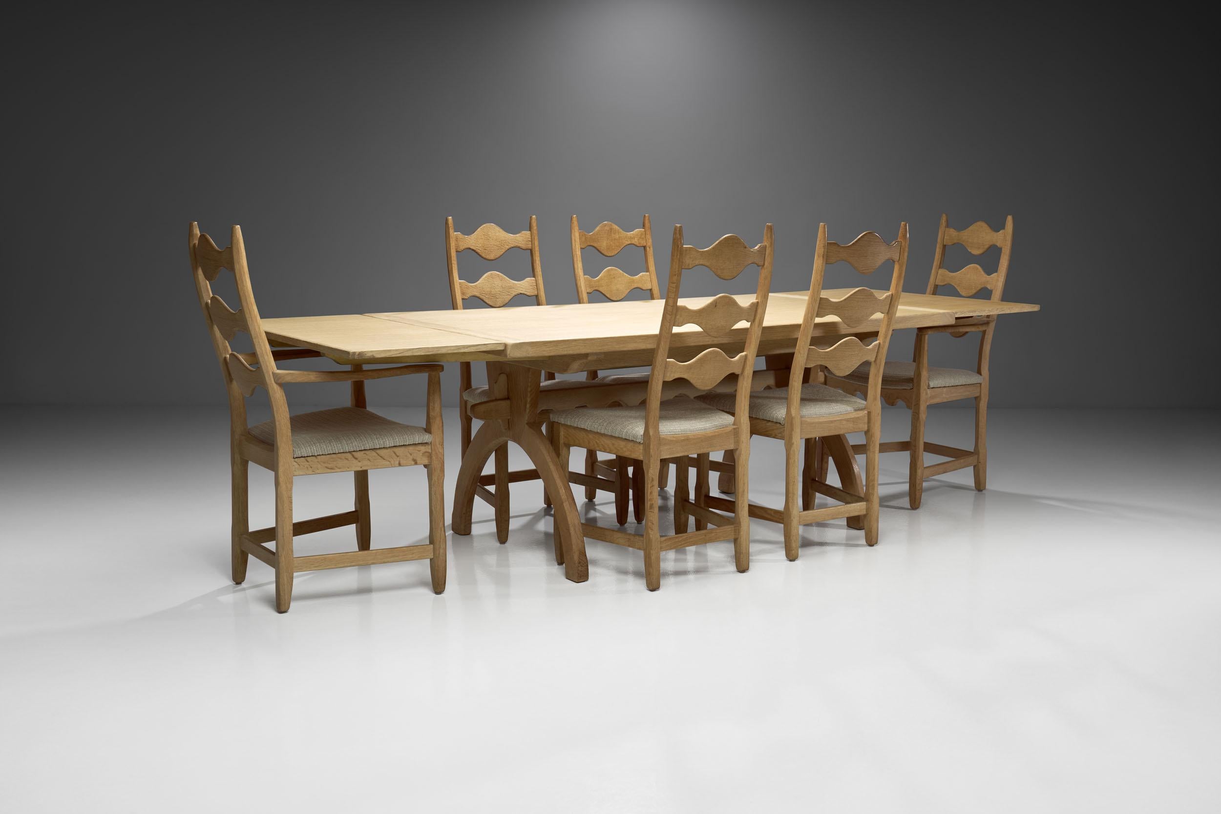 This impressive Scandinavian dining set of seven has an undeniable commanding presence; it begs to be left alone so that air and light can circulate through it. Marked by pale colors, natural materials and lean furniture, the Scandinavian aesthetic