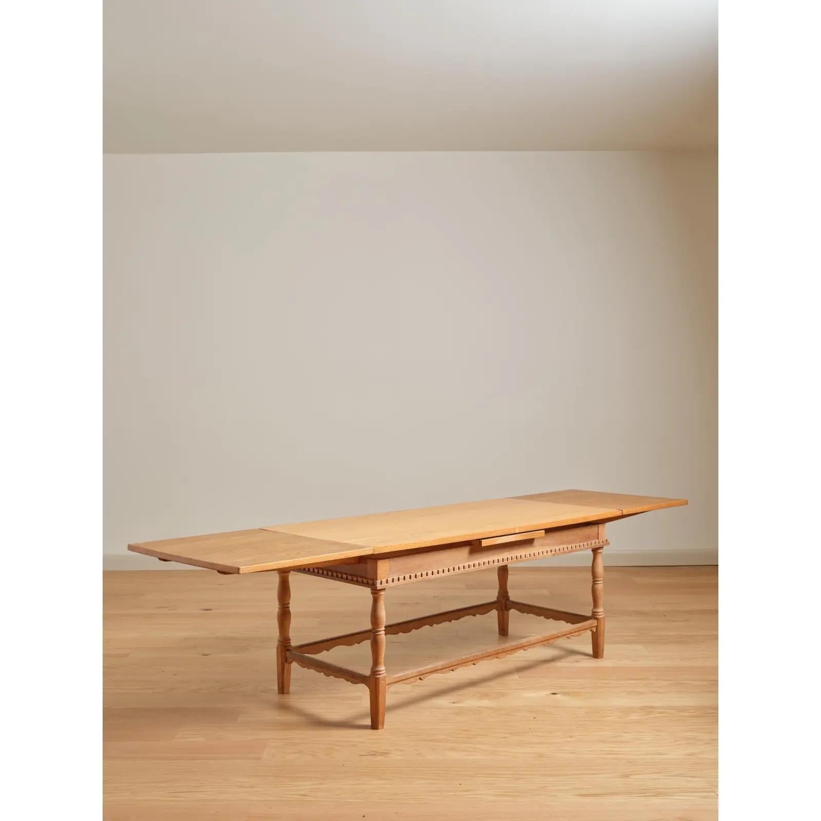 Refectory-style cocktail table or children's dining table in the French taste, with (2) draw-leaves stored beneath the tabletop. c. Late 20th Century