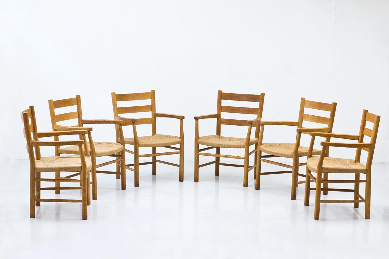 Set of six church armchairs designed by Viggo Hardie-Fischer,
manufactured in Denmark by Sorø Møbelfabrik during the 1950s.
Those Mid-century chairs are made from solid oak frame with paper cord seat. These armchairs showcase a timeless aesthetic,