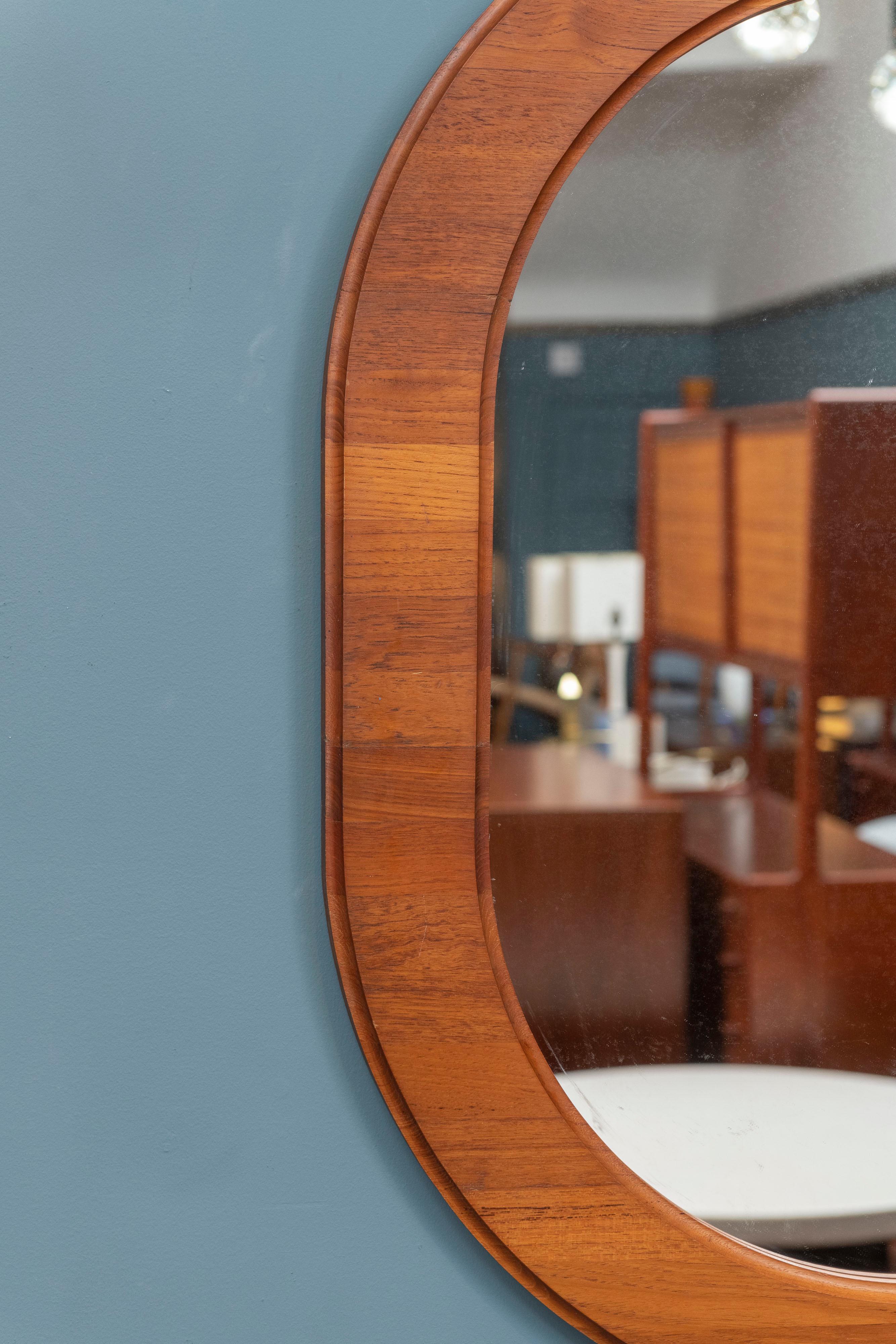 Scandinavian oval teak wall mirror, high quality design and construction ready to install.