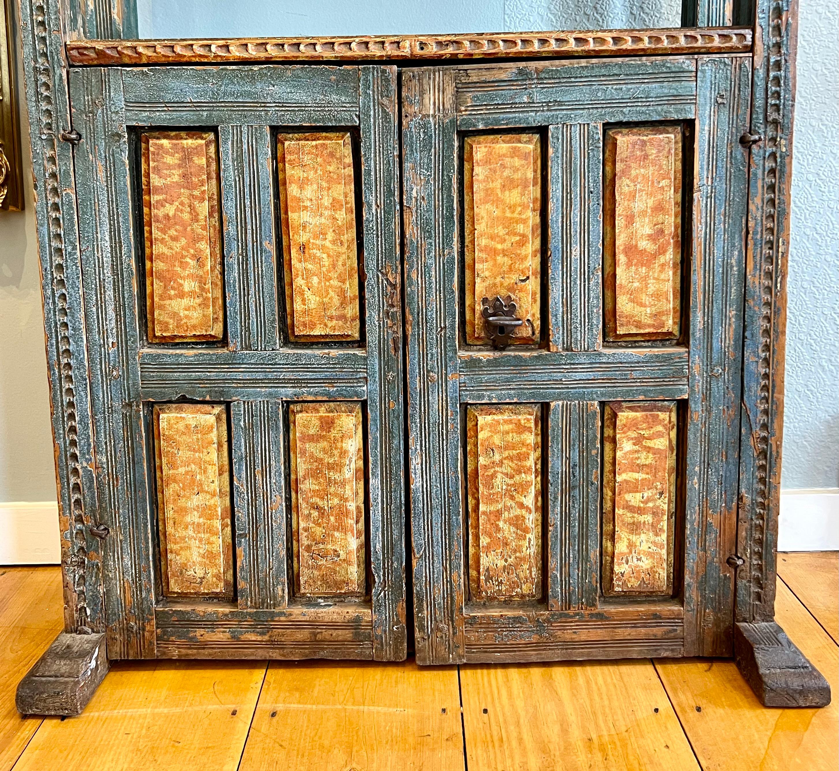 Very rare and interesting paint decorated bookcase with cabinet below and shelves above. Early 19th century or late 18th. Original lock and key and early paint. A very useful proportion and sturdy. Scandinavian, possibly Swedish or Norwegian.