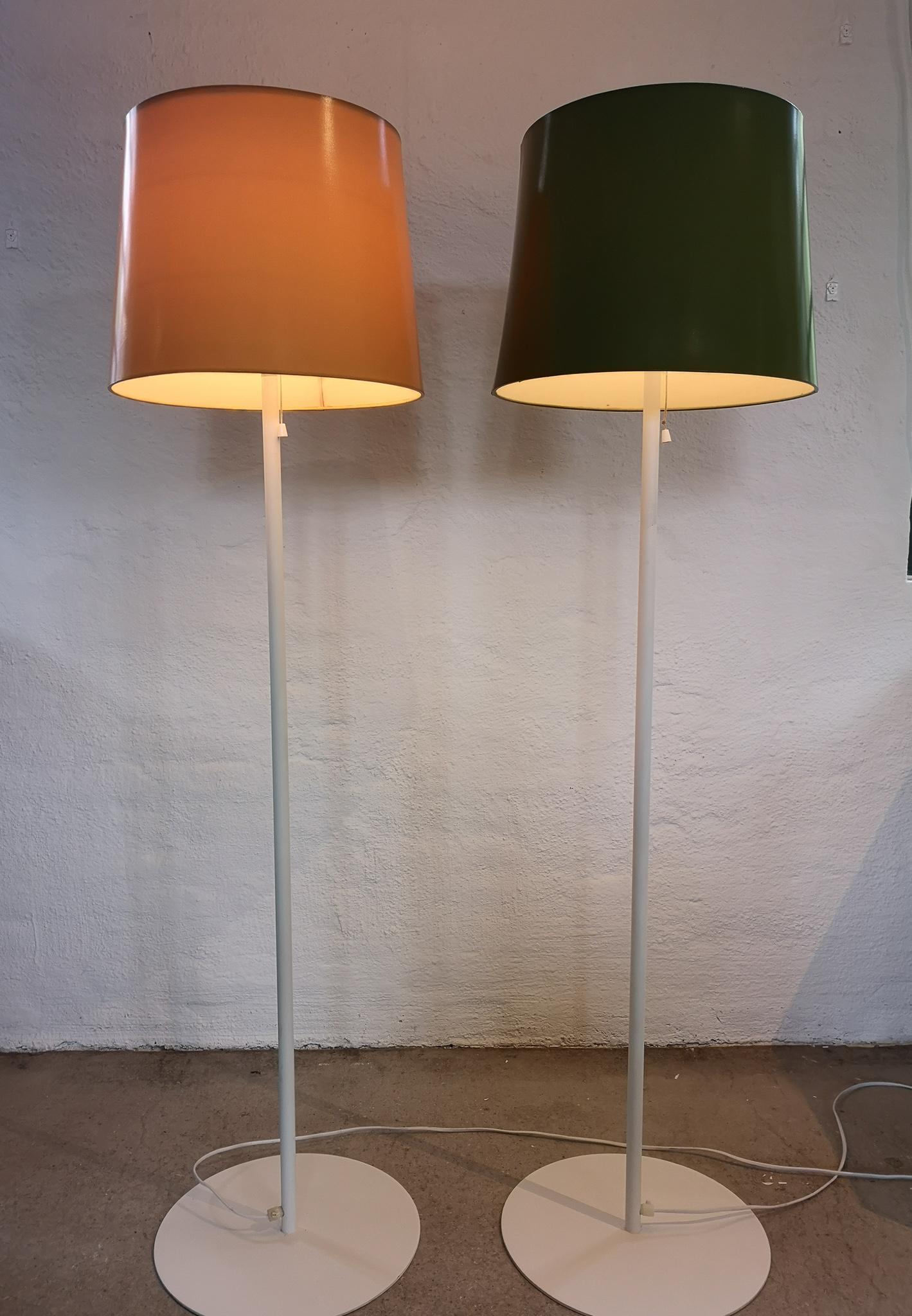 Two floor lamps manufactured in Sweden and Luxus. They are made in white with an iron cast base. The uplight shades are in acrylic. The shades are the original ones.

Nice vintage condition. 

Measures: Height 138 cm, base 36 diameter, shade 32