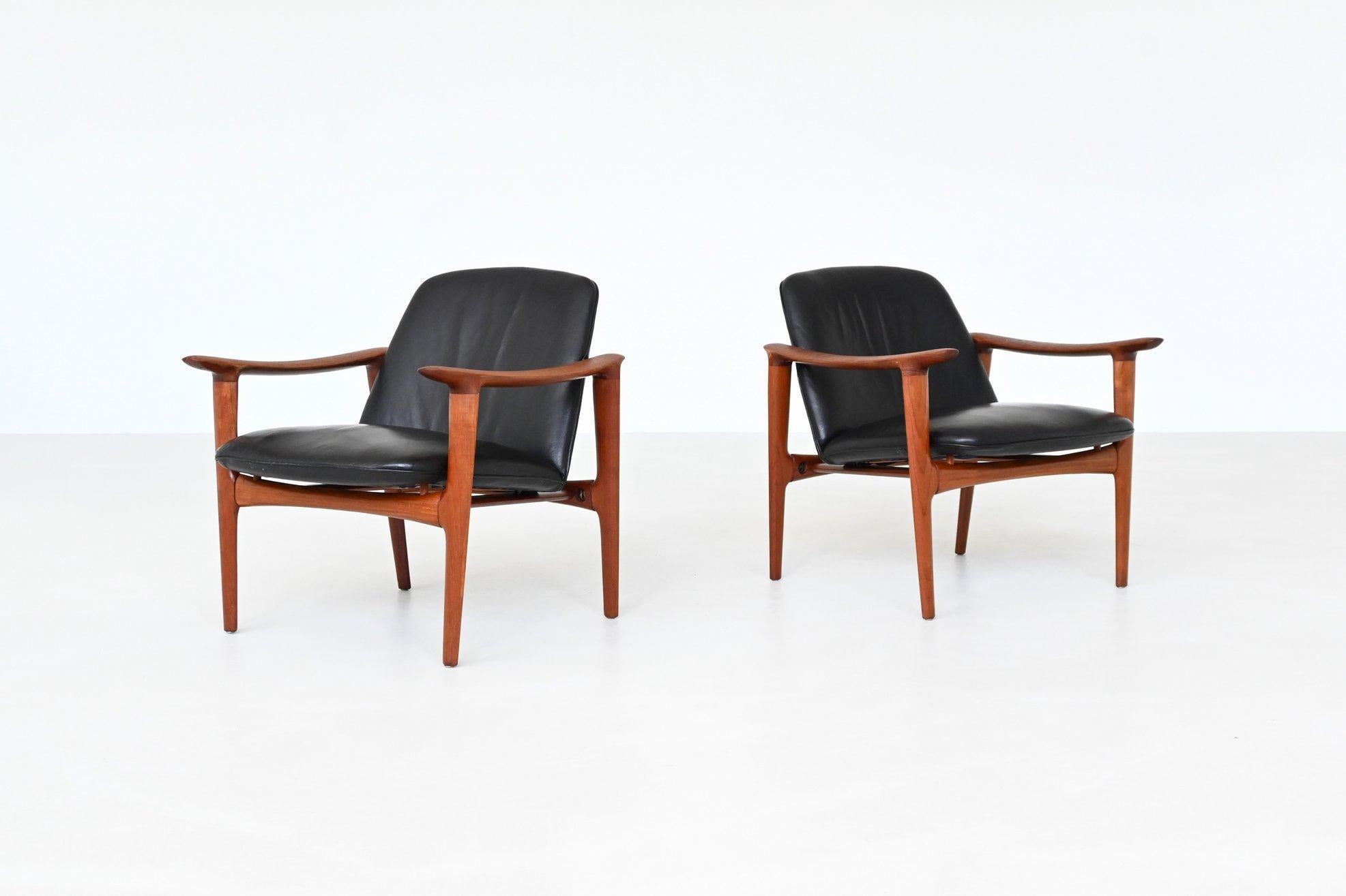 Pair of sculptural lounge chairs in solid teak and black leather, manufactured by Westnofa, Norway 1960. This unique set showcases the refined Scandinavian design language with flowing organic lines, beautifully shaped armrests, and subtly tapered