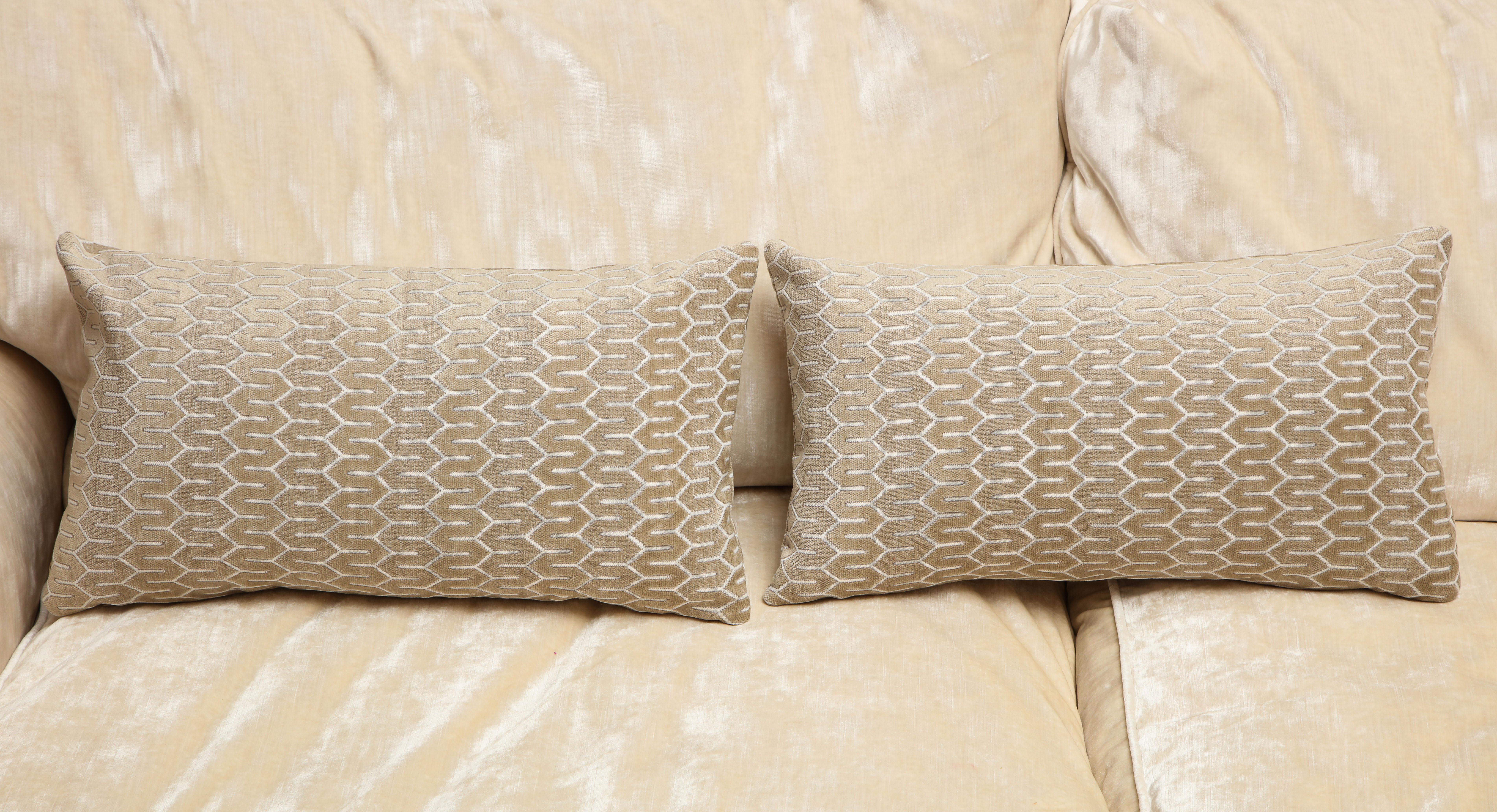 One of the kind silver pair of decorative pillows, designed by Arlene Angard Designs. Zigzag pattern adds texture and easily adaptable to any interior space with its neutral color. 
Closure stitch with a custom made pillow insert of down