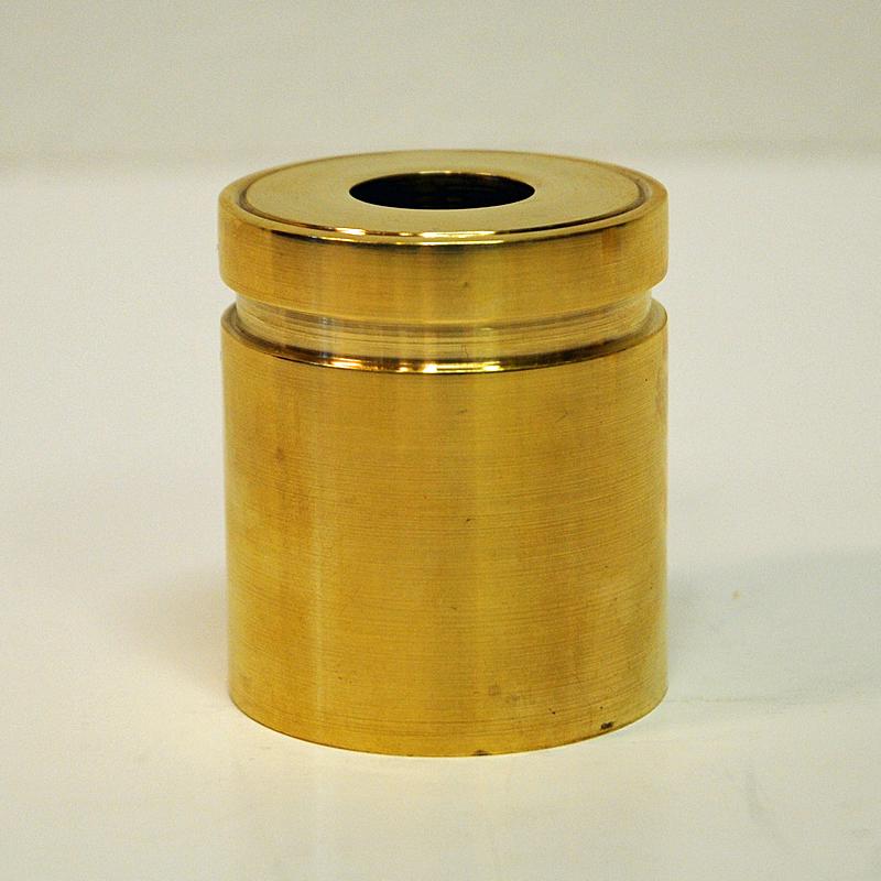 Stylish vintage decorative brass cylindershaped candlestickholders for thinner candlelights from around the 1960`s. Decorative inner edge on top. Heavy weight. Dia: 5 cm. Height:  5.5 cm.
Classic design in a pure cylindrical shape. Scandinavian