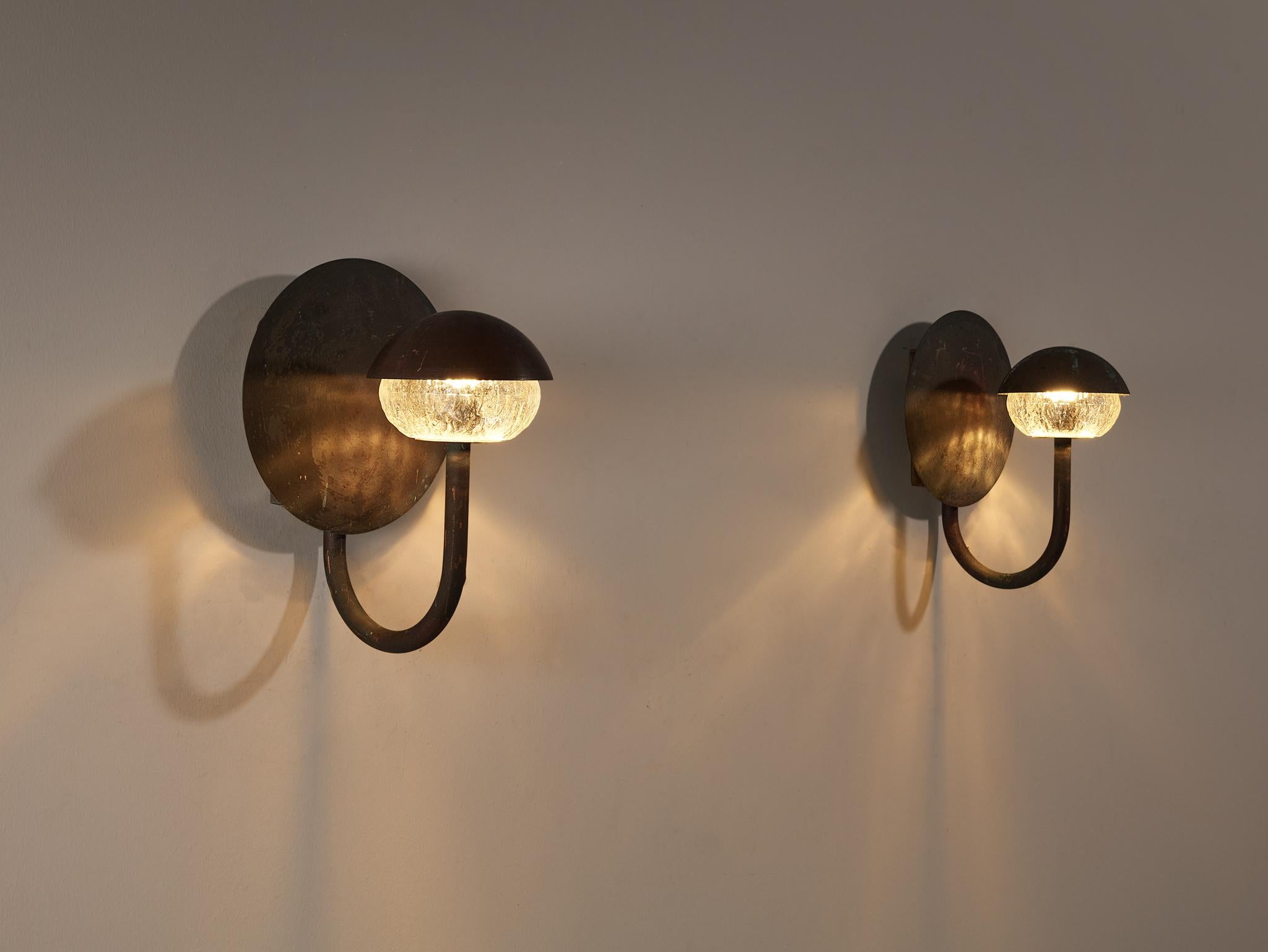 Pair of wall lights, patinated copper, glass, Scandinavia, 1960s

Charming pair of wall lights executed in copper with a ribbed glass shade. This lamp exists of a copper circular wall plate, connected to the copper arm which holds the sphere.
It