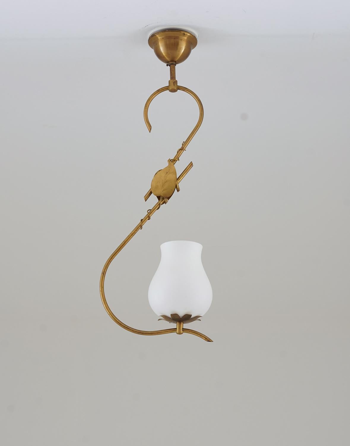 Elegant pendant in brass and frosted glass in the manner of Hans Bergström, produced in Sweden. 
The frosted glass gives a beautiful and soft light and the brass parts have a nice natural patina.
Condition: Good original condition with patina.