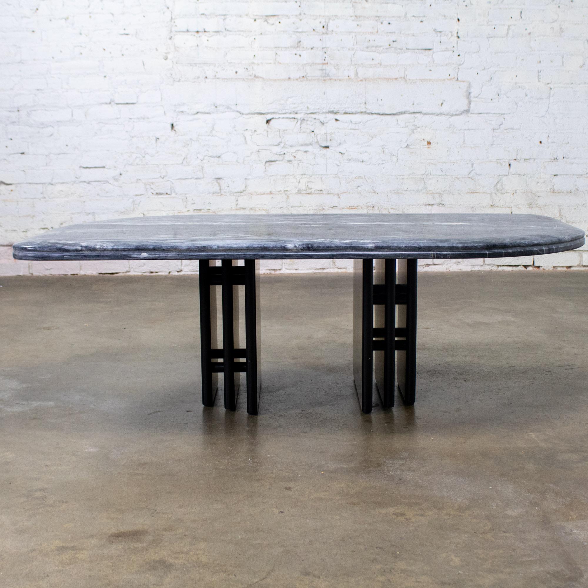 Fabulous Late 20th Century Scandinavian Modern to Postmodern coffee table comprised of a cat eye shaped gray & black Gneiss or marble top with an eased edge & quarter rounded corners & black lacquered wood double pedestal base by