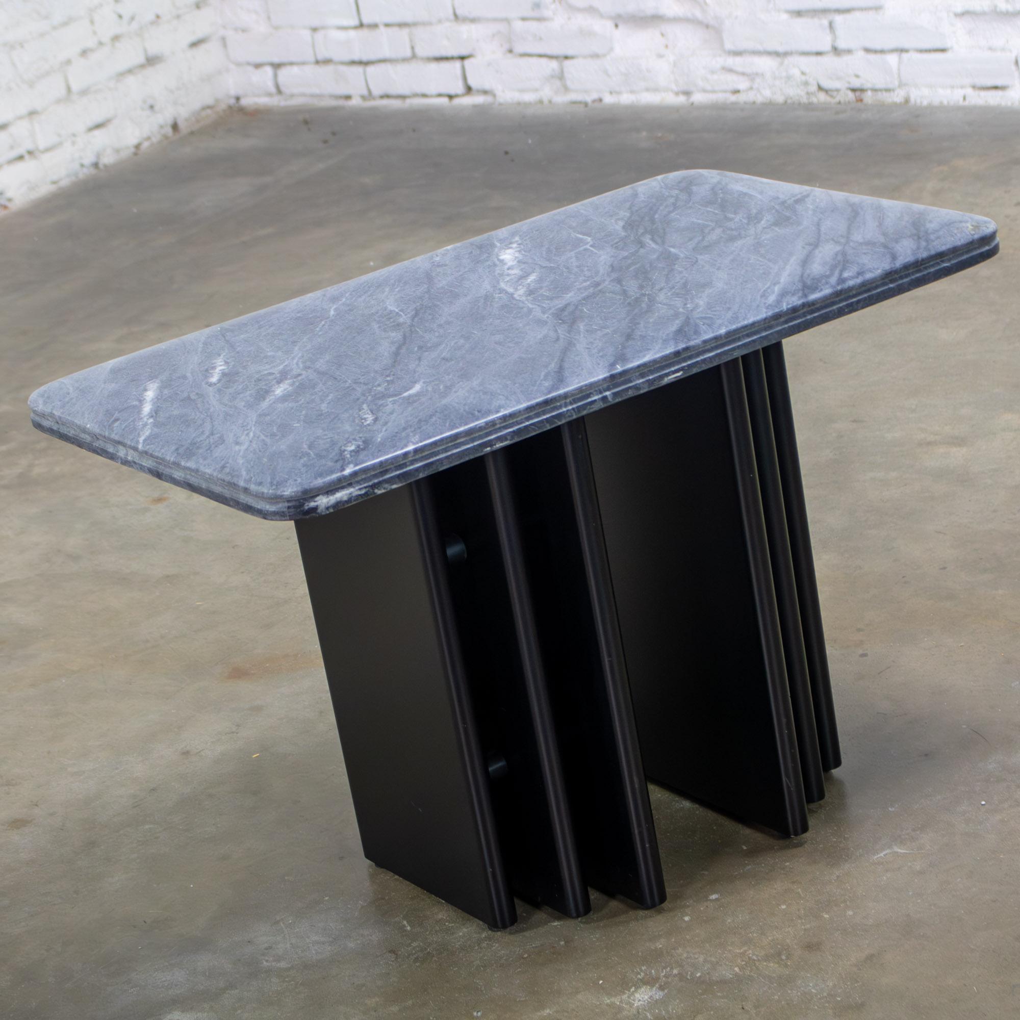 Fantastic Late 20th Century Scandinavian Post Modern to Postmodern end or side table comprised of a rectangular shaped gray & black Gneiss or marble top with an eased edge & quarter rounded corners & a black lacquered wood double