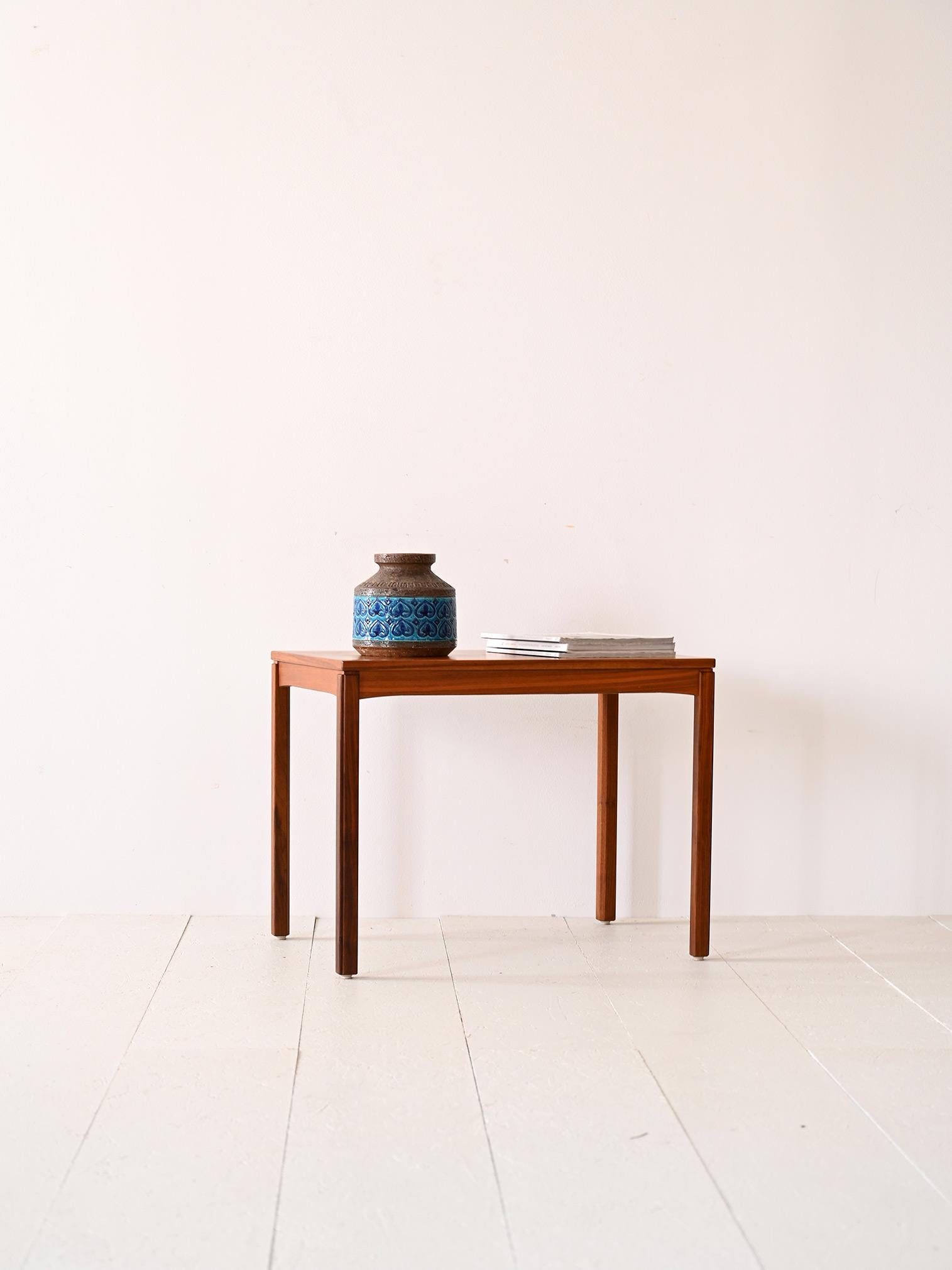 Original vintage 1960s bench table,

Square, regular lines distinguish this mid-century Nordic-made coffee table. The essential teak frame consists of a rectangular table top and long square legs.
It can be used either as a coffee table for the sofa