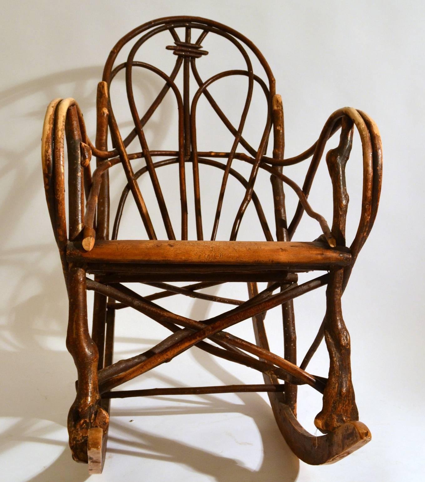 Scandinavian early 20th century rocking chair crafted and constructed in knotted wood and bentwood willow with a wooden slat seat. The rocking slats and seat are made of bent wood.
Extremely comfortable, relaxing and strong and with real sculptural