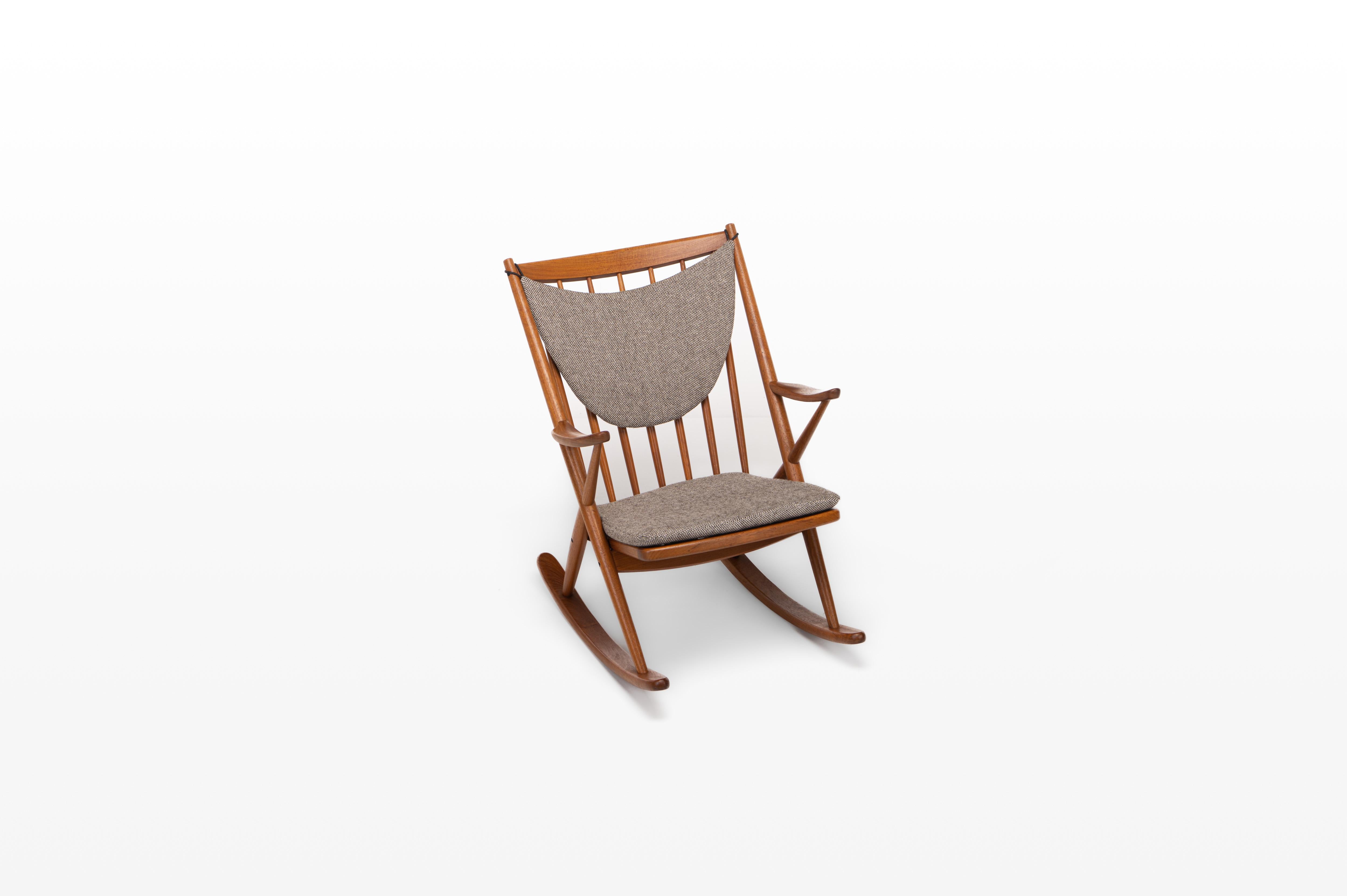 Vintage rocking chair designed by Frank Reenskaug for Bramin in the 1960s. The chair has a teak and has the original fabric.