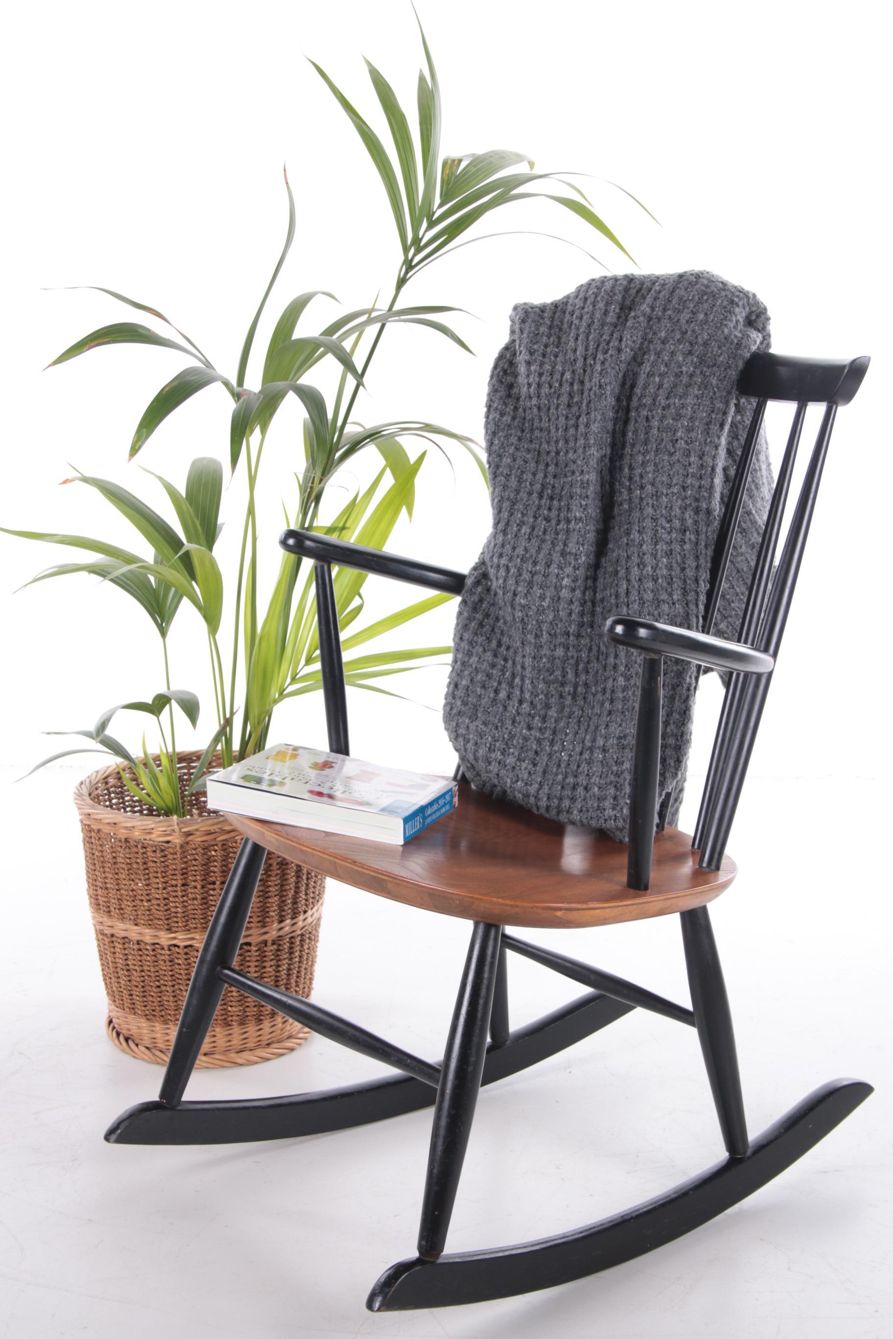 Rocking chair by Hagafors Stolfabrik Sweden, by Roland Rainer, from the 1960s. 

The chair is made of solid wood and painted black. With a beautiful wooden seat.

This fits nicely with a Bohemian style and then wonderful with a book.

The