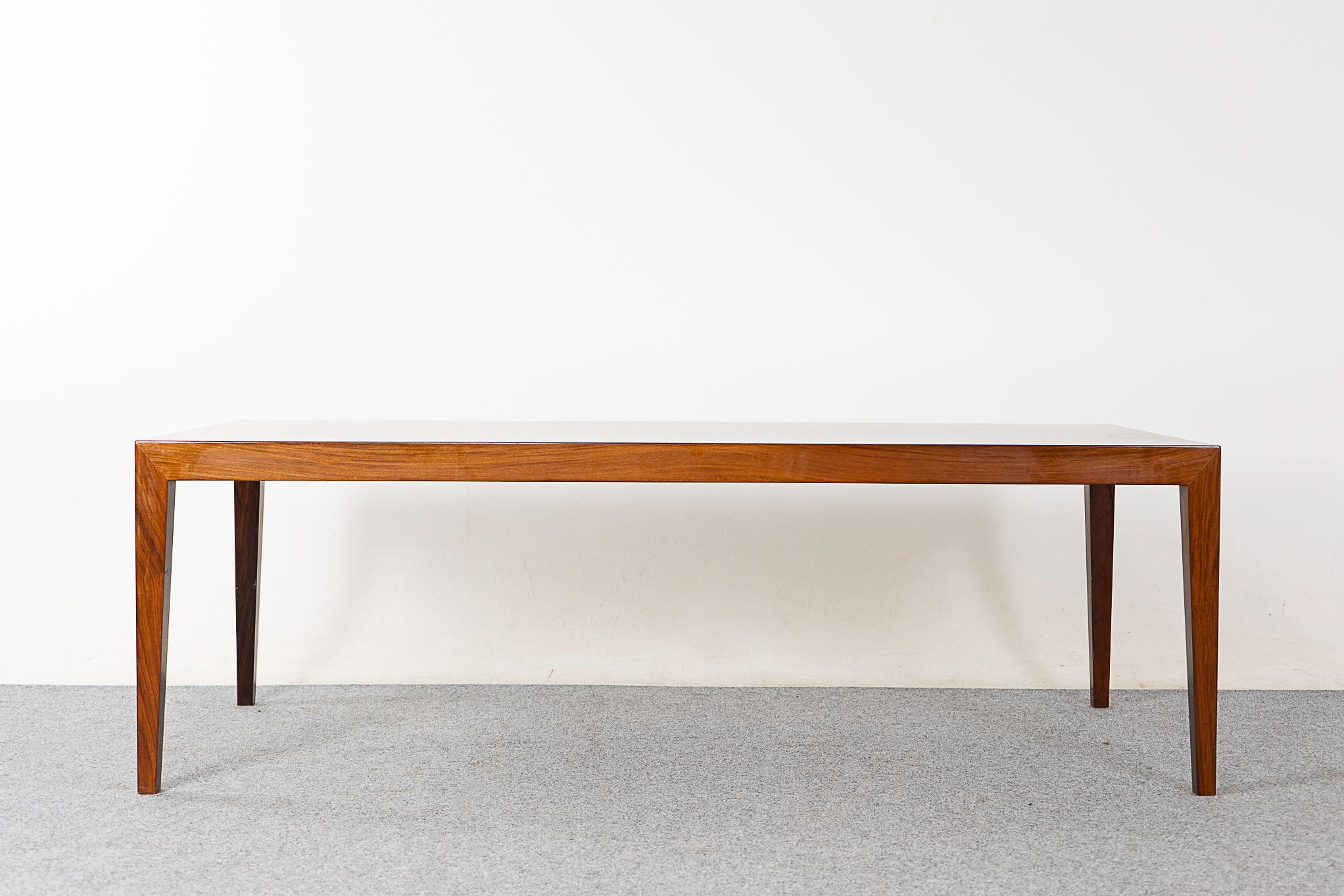 Rosewood mid-cenury coffee table by Severin Hansen for Haslev, circa 1960's. Stunning graining on the bookmatched veneered top and slick angular corner joinery design! A generous surface area for your living room.  

Please inquire for remote and